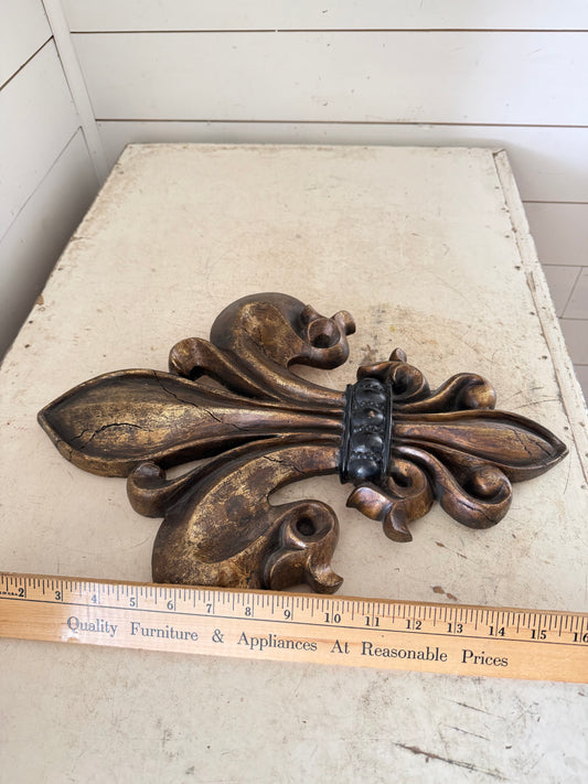 Large resin Fleur de lis will get makeover