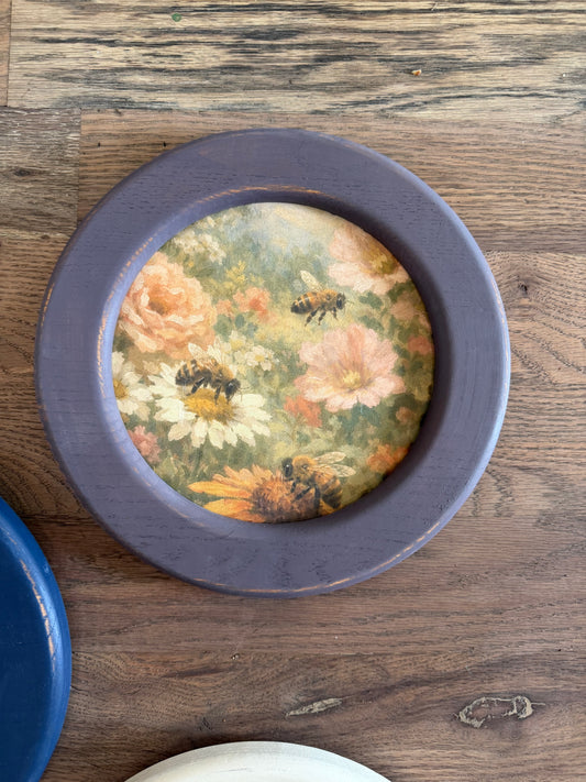 Art in round wood hand painted frame 10.25”