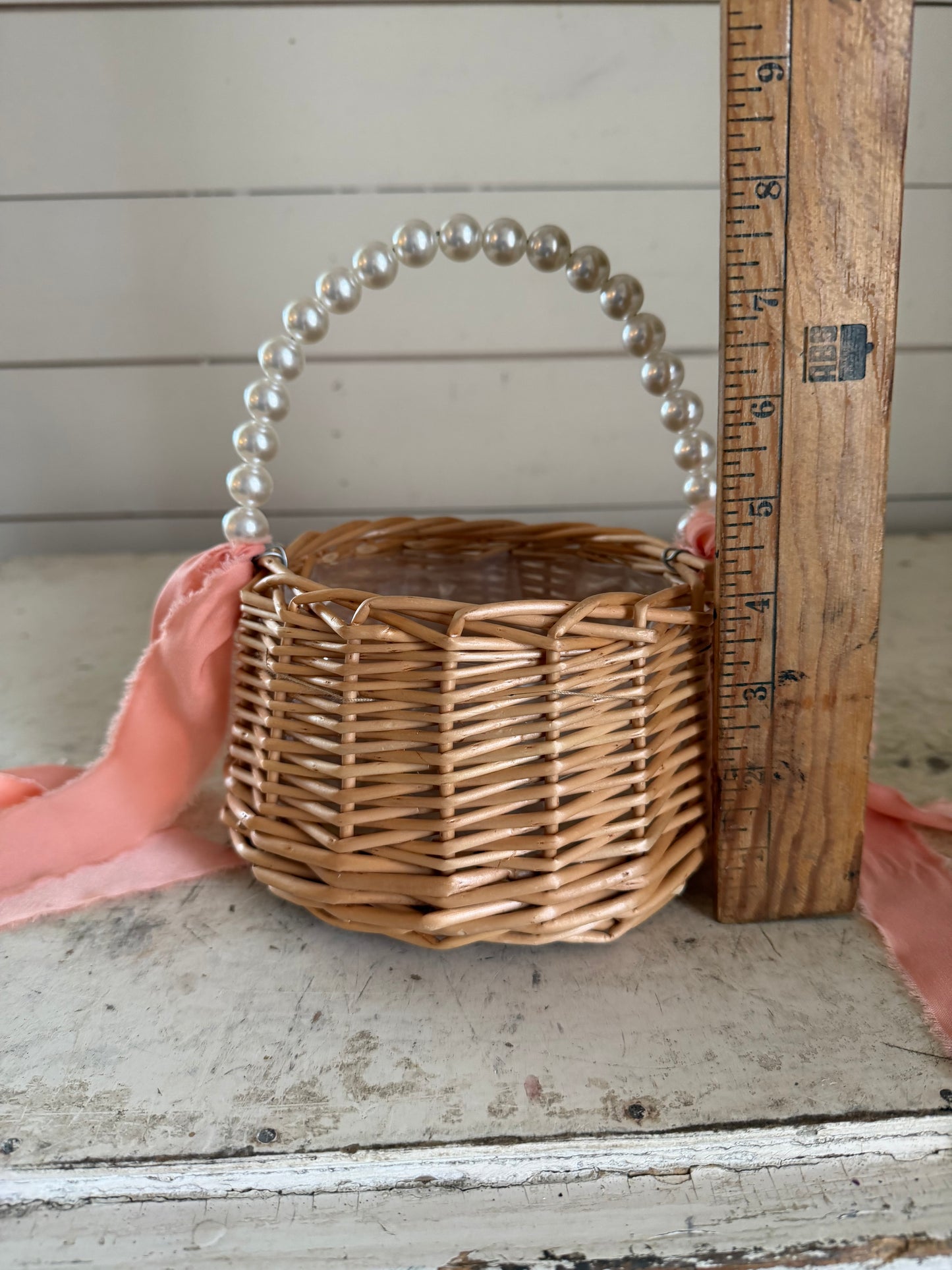 Flower girl basket with faux pearl handle with pink ribbon