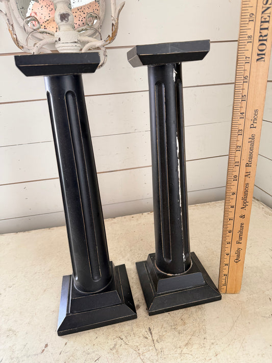 Set up two large black pillar candlesticks will get makeover