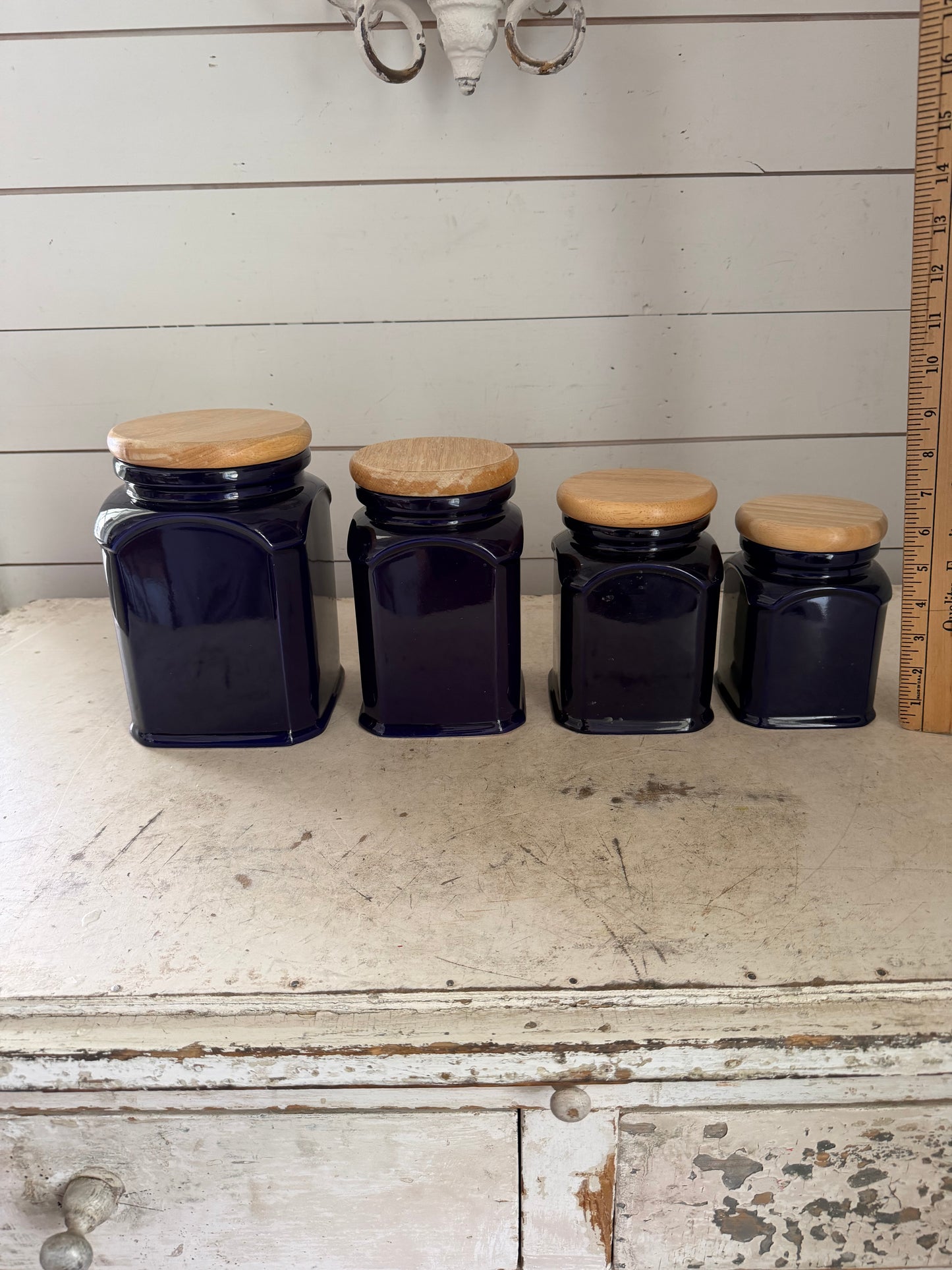 4 cobalt blue ceramic kitchen canisters with wooden lids