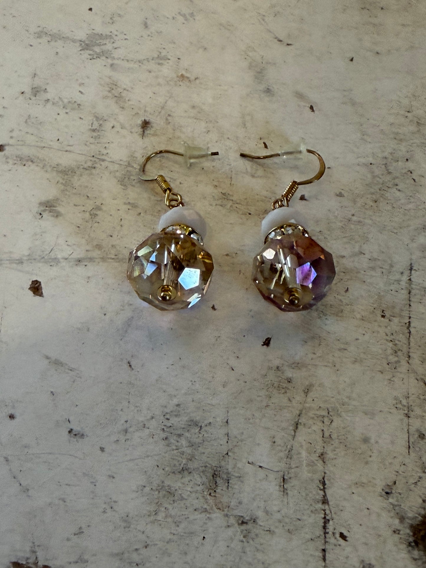 Vintage champagne bronze glass dangle earrings with an antique brass finish