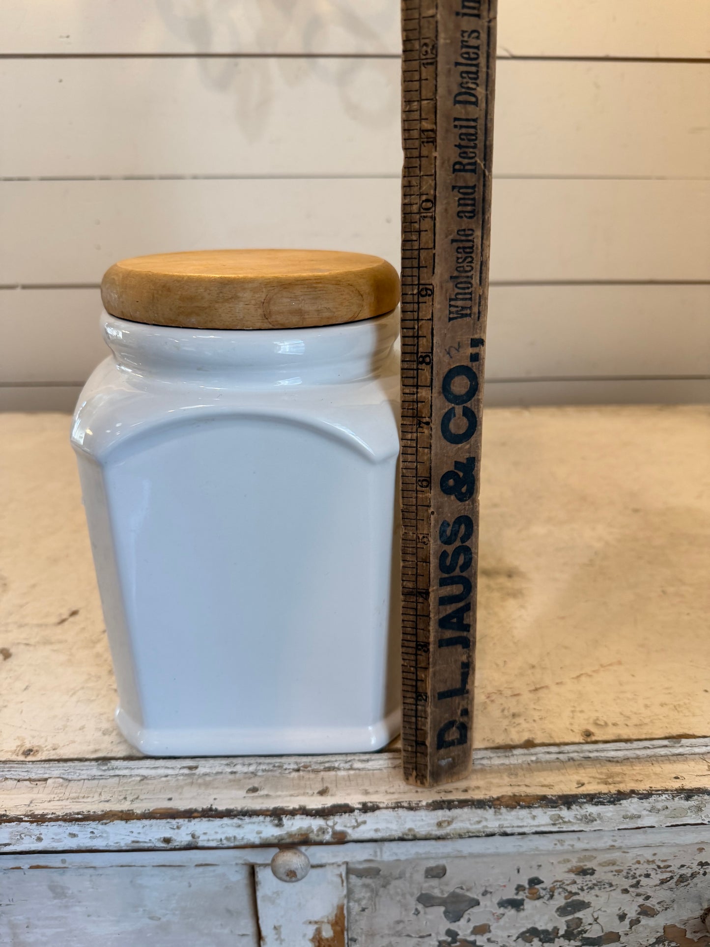 White Ceramic and light wood hexagon Canister will get IOD