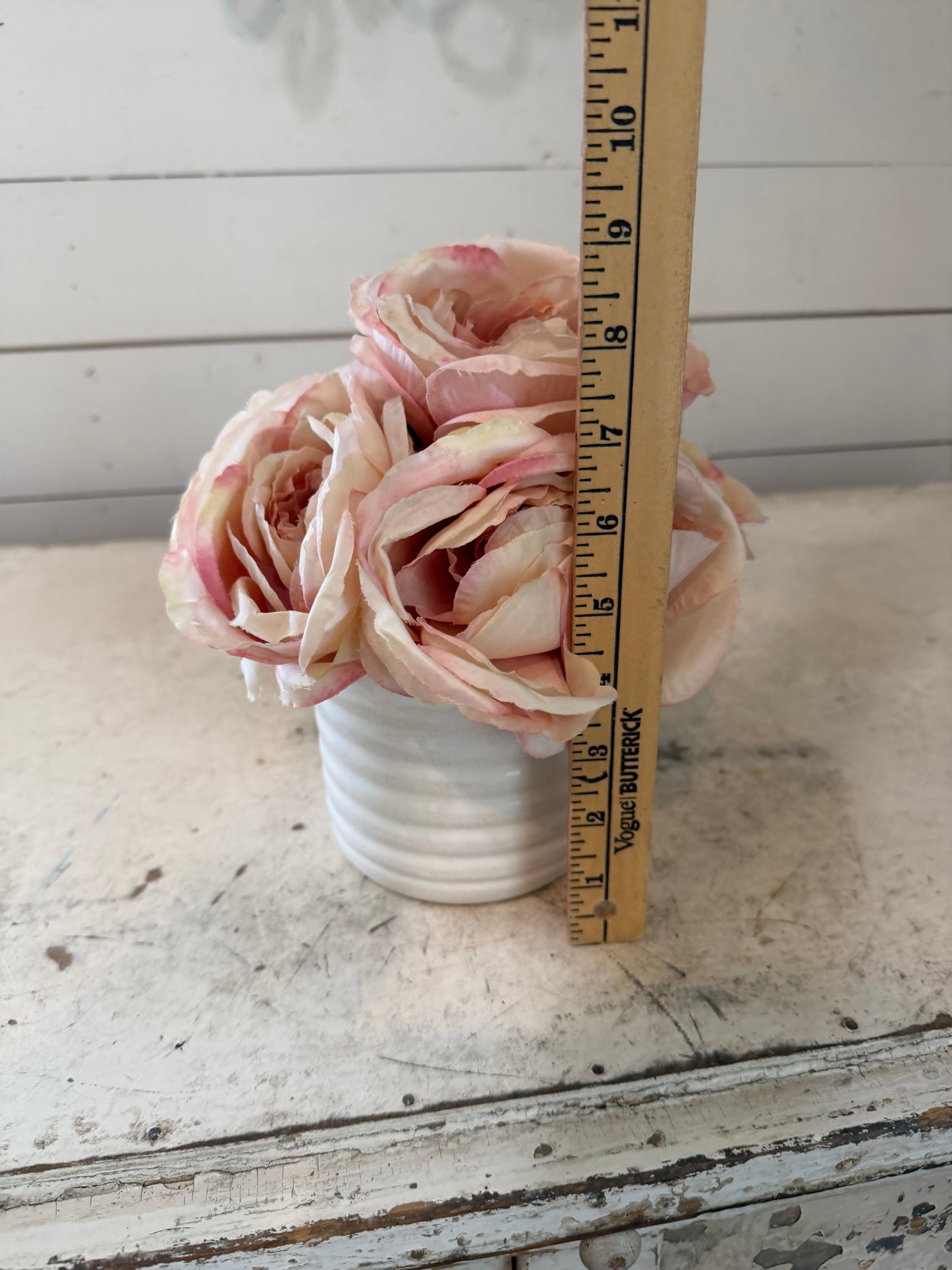 White porcelain pot with pink roses
