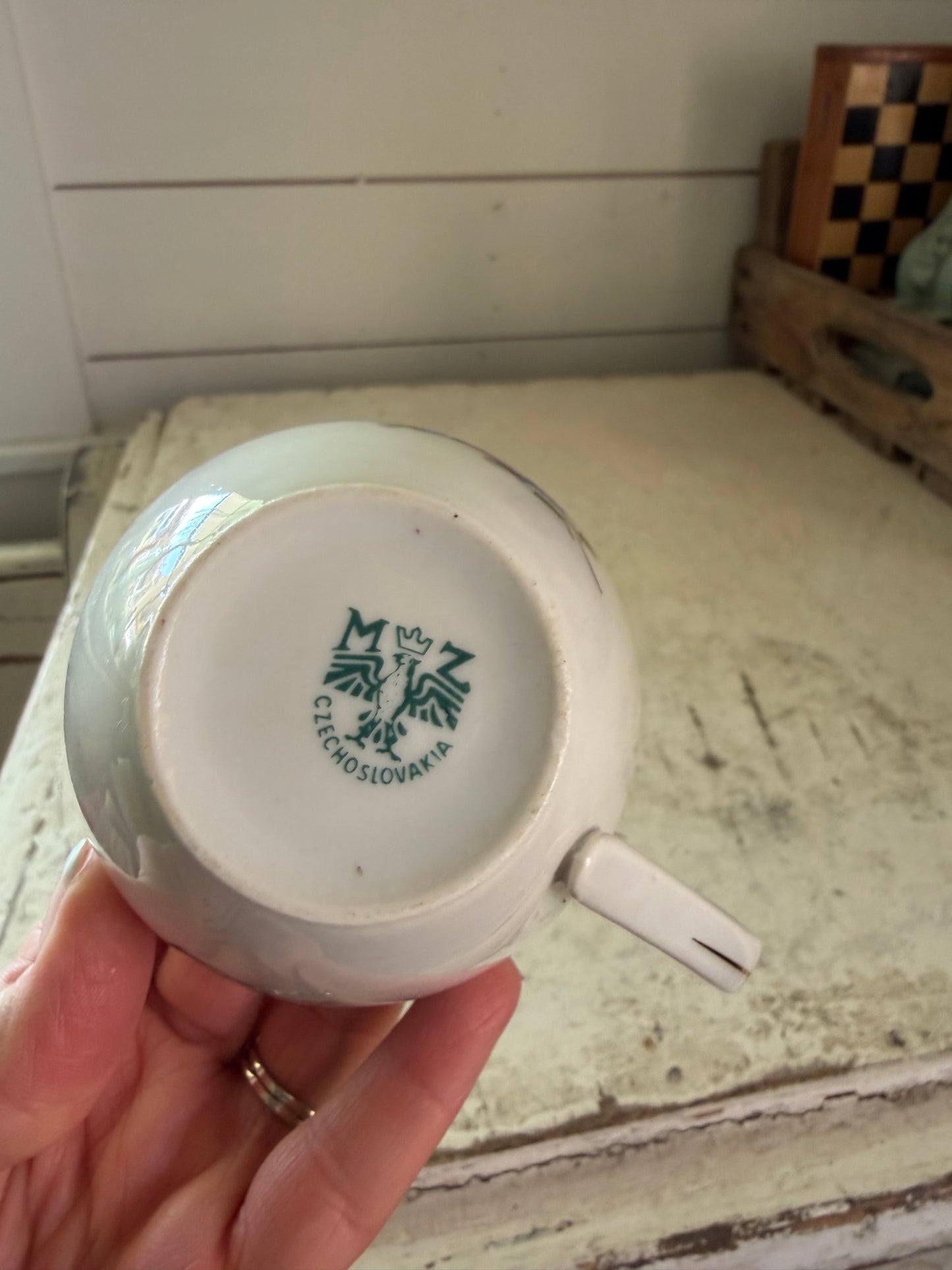 Vintage bone china teacup with a floral pattern and gold trim