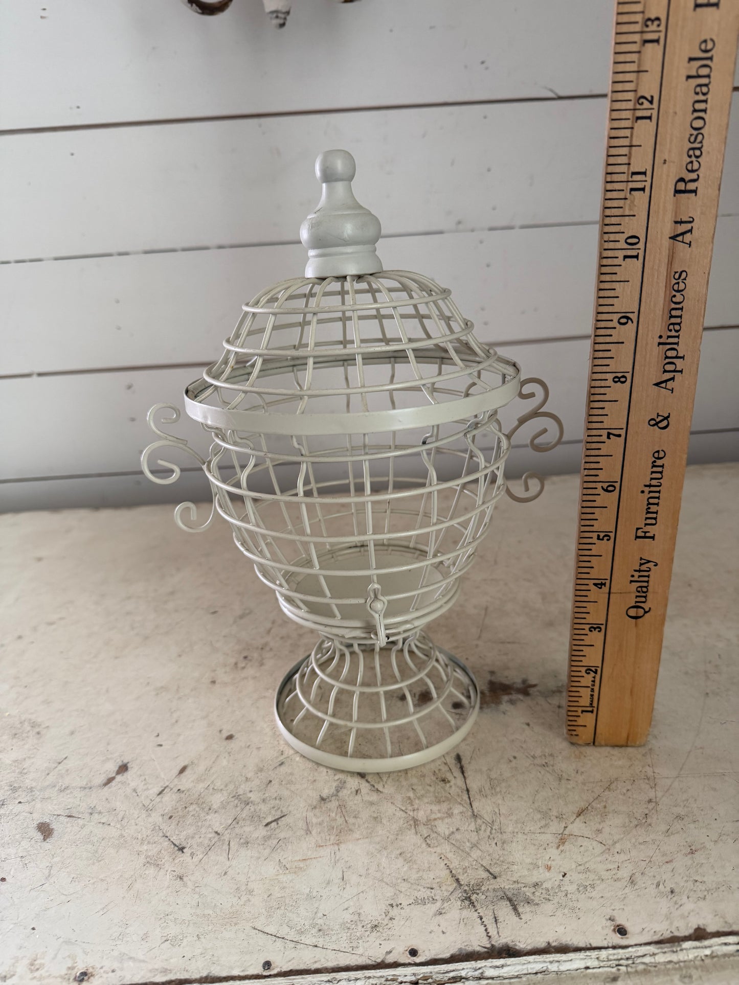 White decorative birdhouse style urn with lid