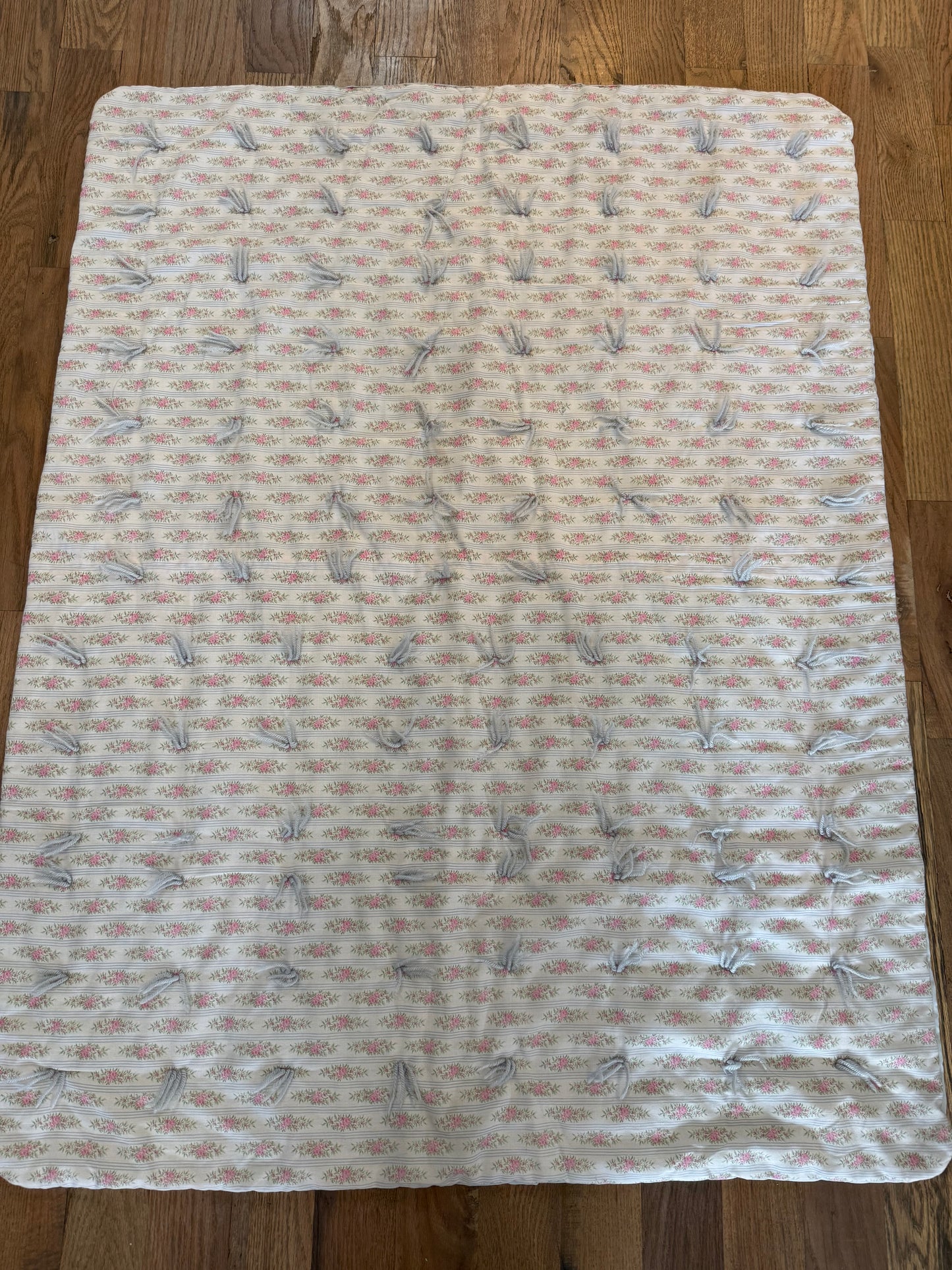 Pink and blue baby floral quilt with ties