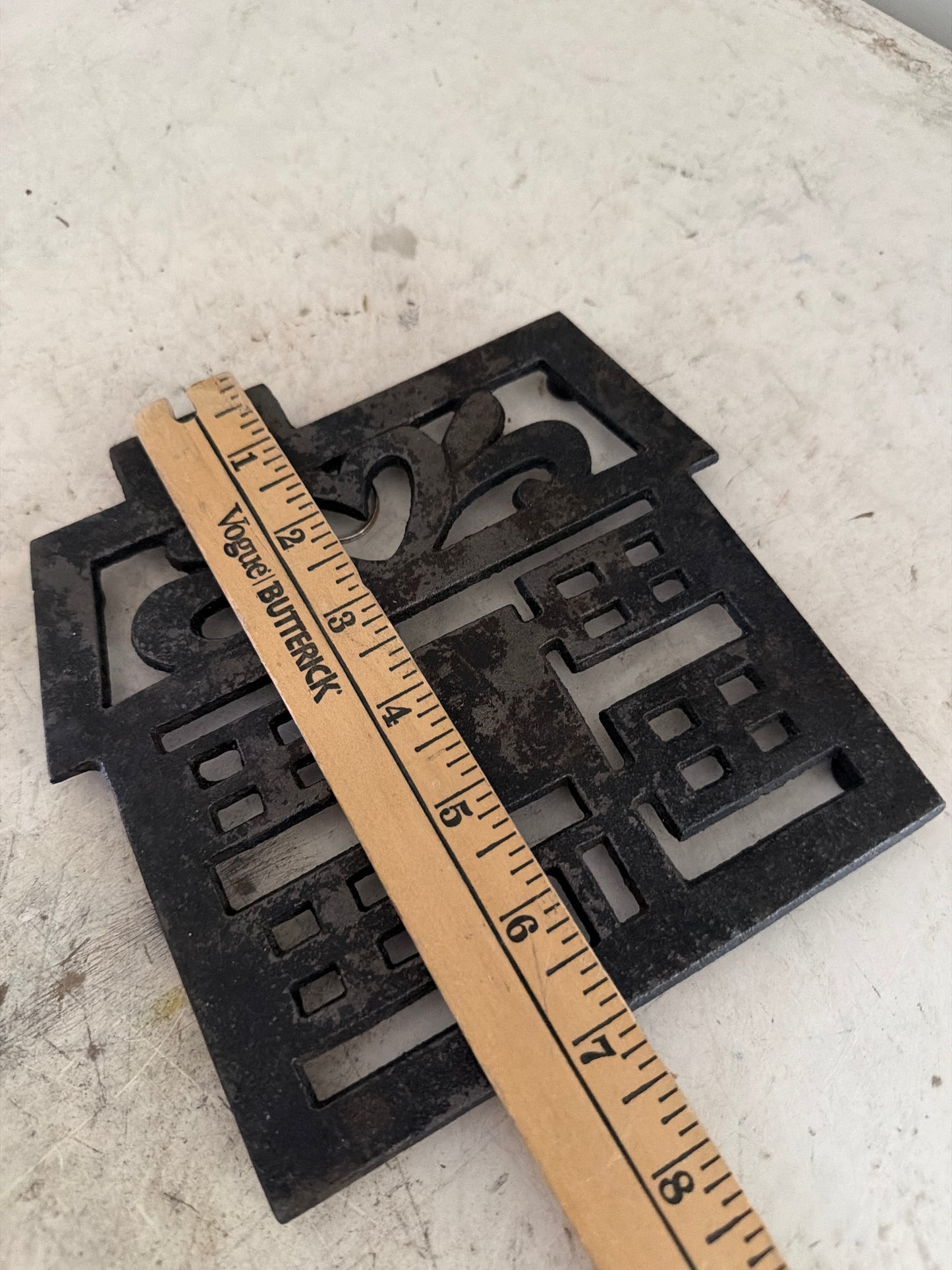 Cast-iron House trivet