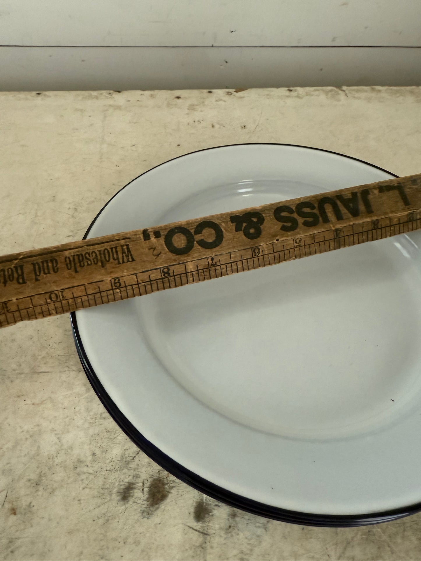 White enamel plate with navy edge sold individually