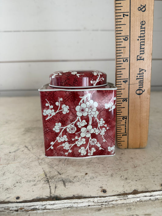Daher decorated tin with a red and white cherry blossom pattern
