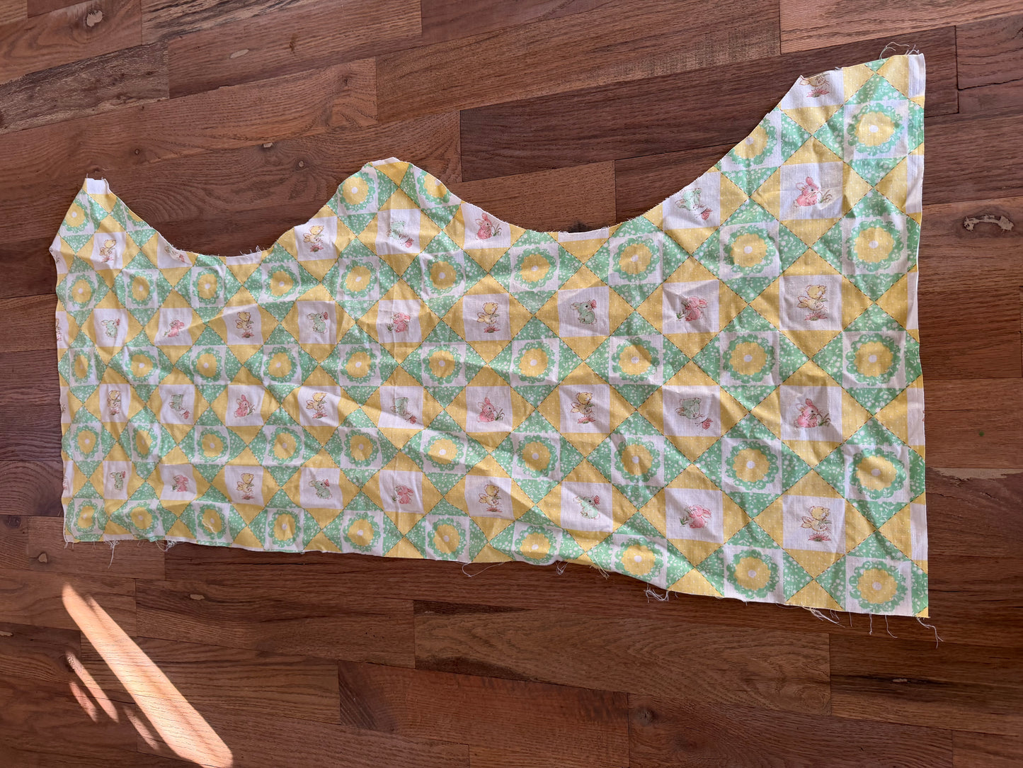 Approximately 1/2 yard of scrap green and yellow bunny fabric