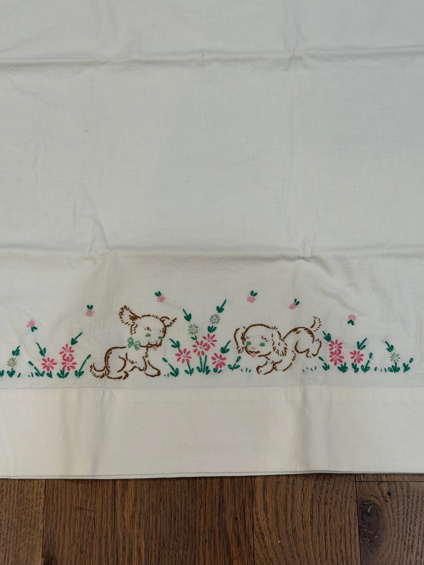 Puppies playing in flowers embroidered pillowcase
