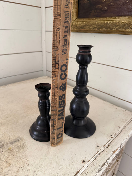 Set of black metal candlesticks
