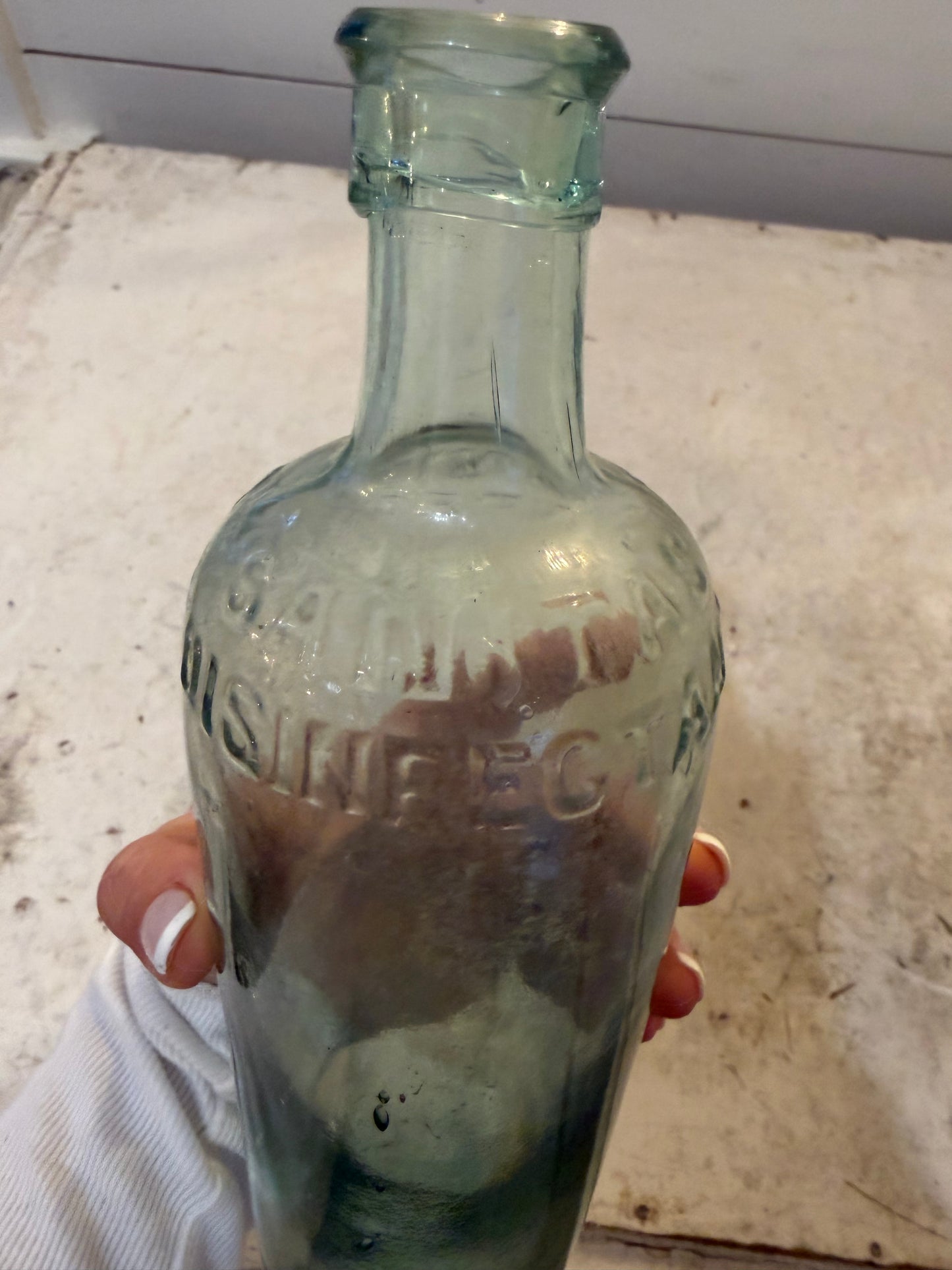 19th Century Sanitas Disinfectant aqua-colored bottle