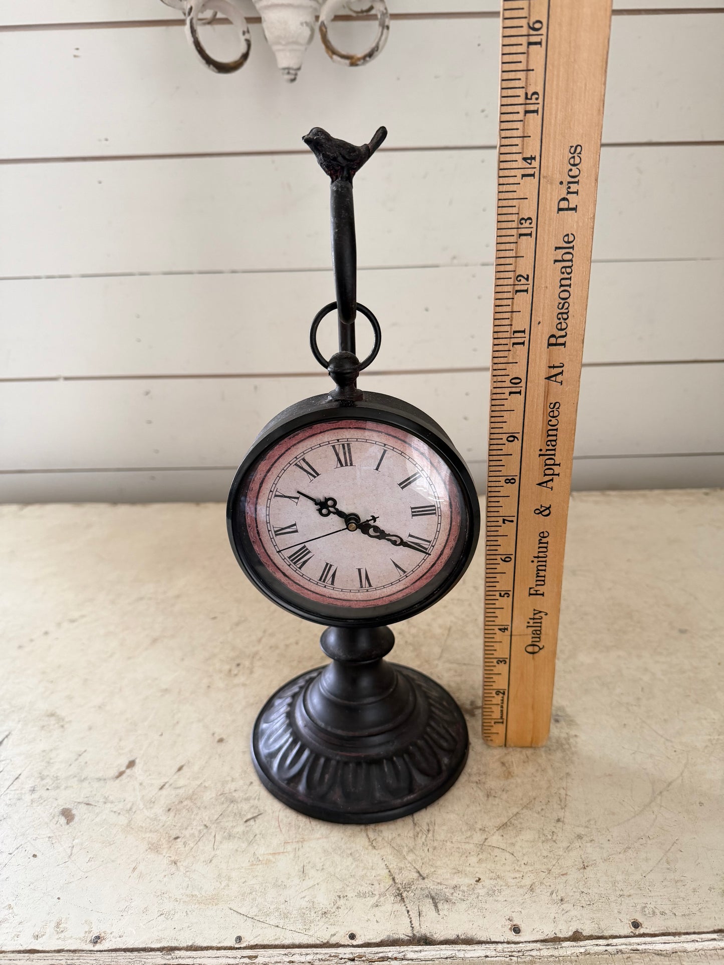 Pocket watch on a stand with a bird on top clock will get makeover
