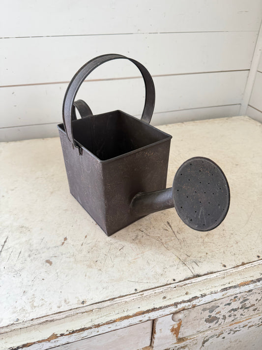 Faux watering can metal planter will get makeover