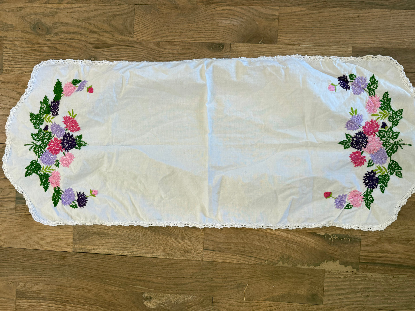 Purple and pink embroidered table runner