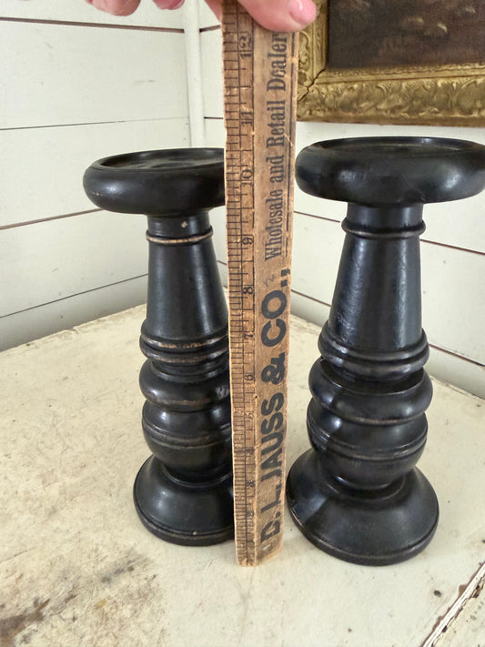 Set of black distress turned candlesticks