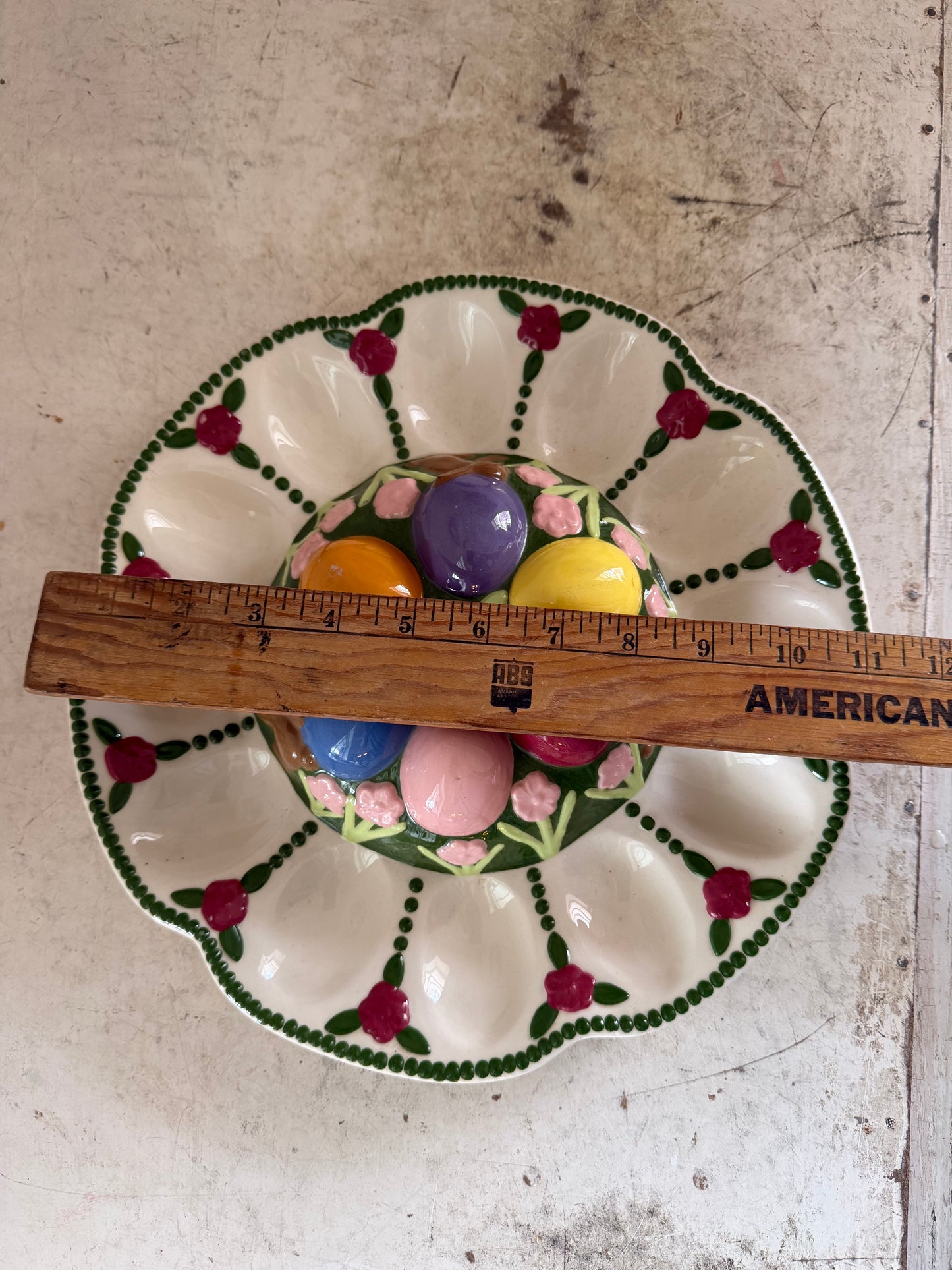 Vintage Easter deviled egg platter with chocolate bunnies, and flowers on it