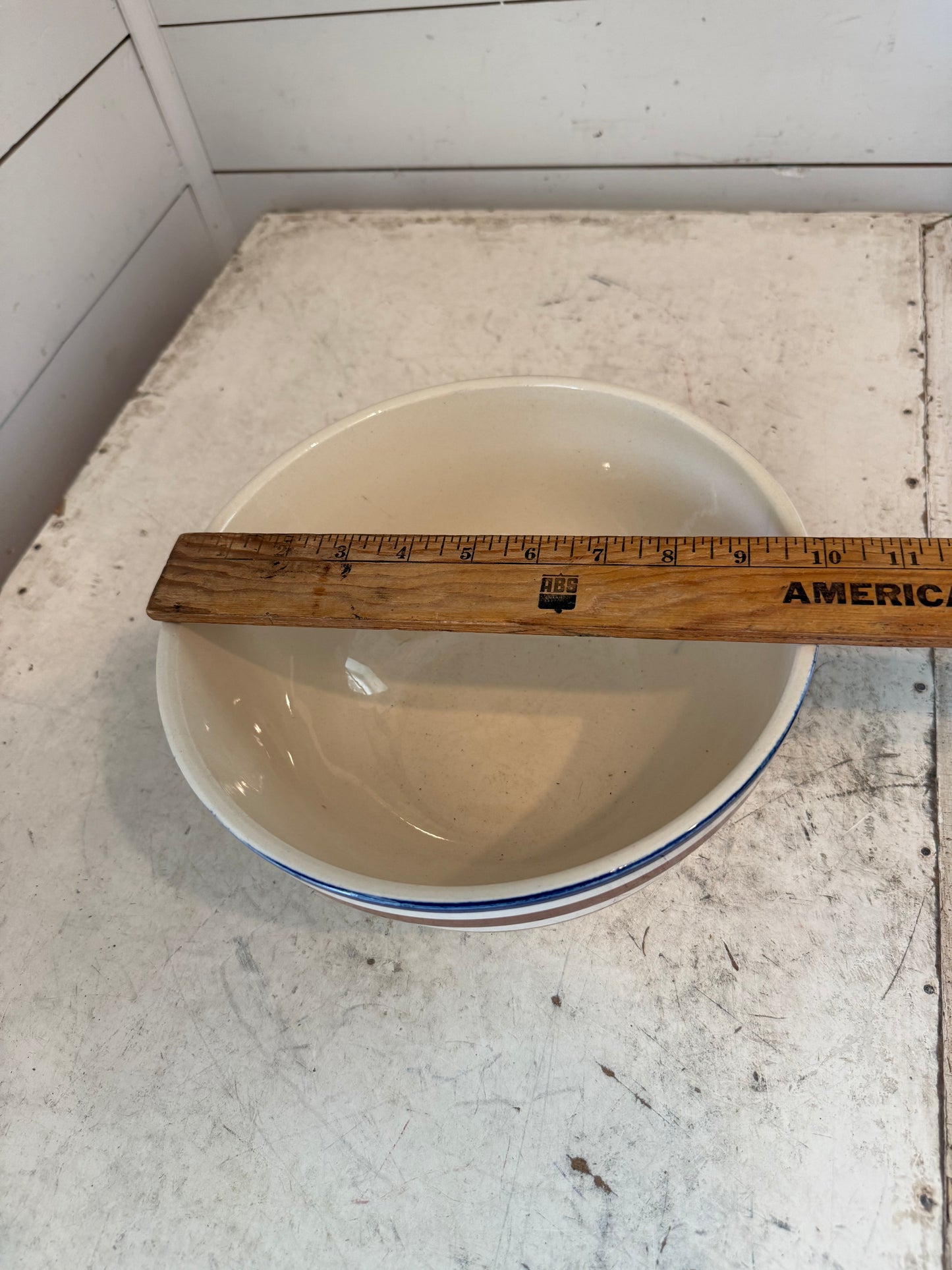 Vintage stoneware bowl has chips as is