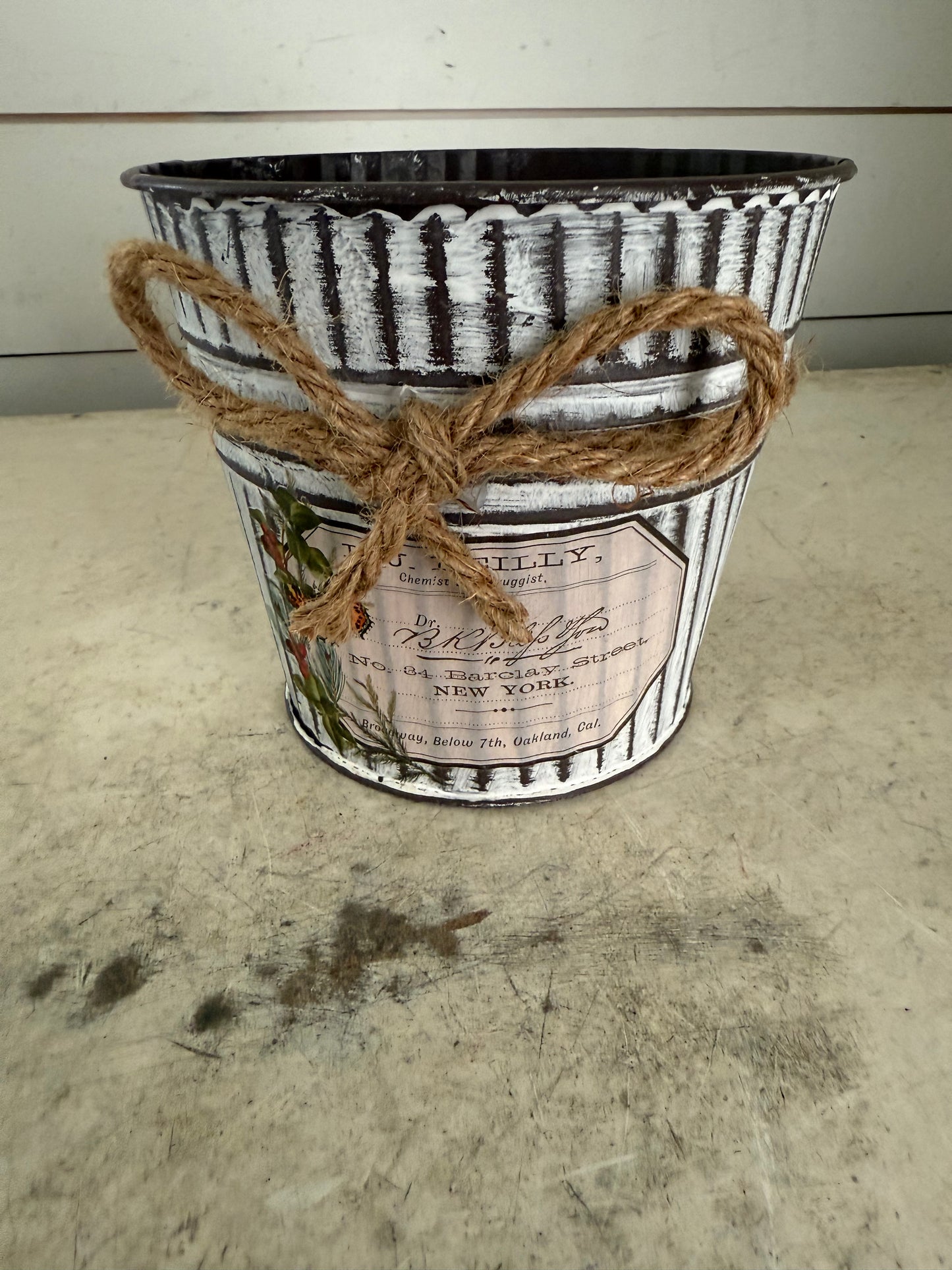 Metal Pot with bow with pink flower arrangement included