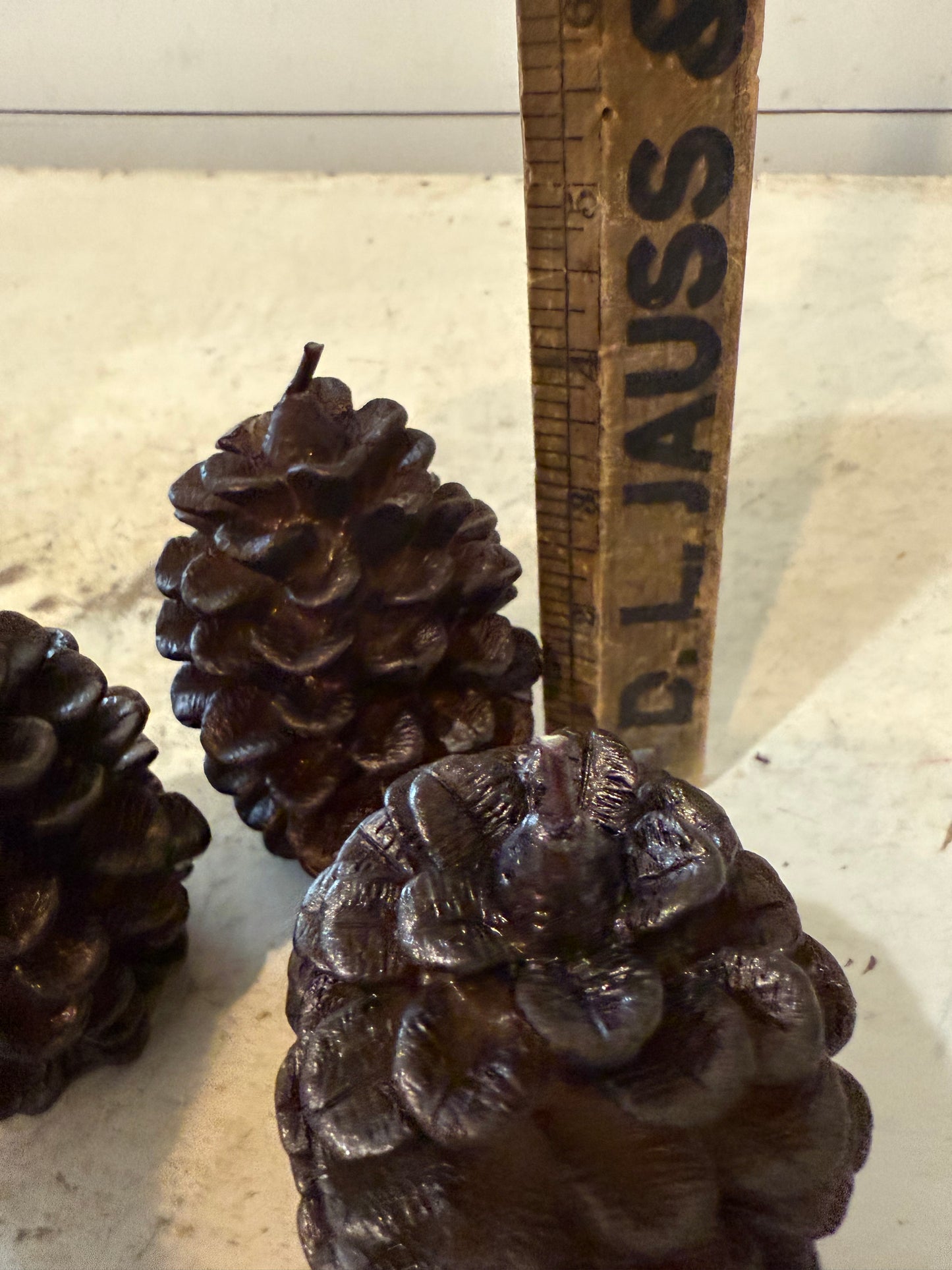 Pottery Barn brown metallic pinecone candle - some of the pinecone petals may be loose in bag - sold individually