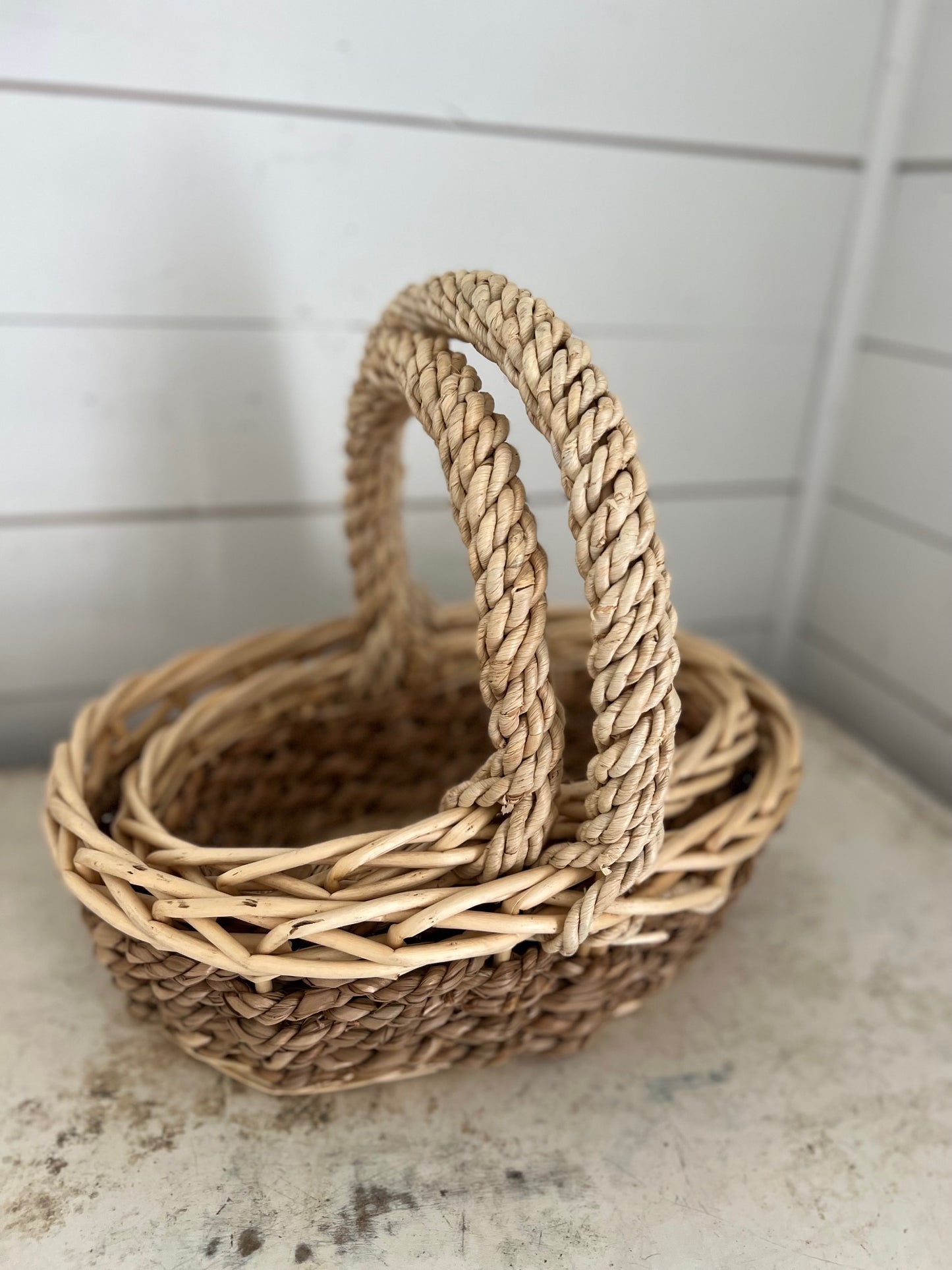 Set of stacking oval baskets with braided handle