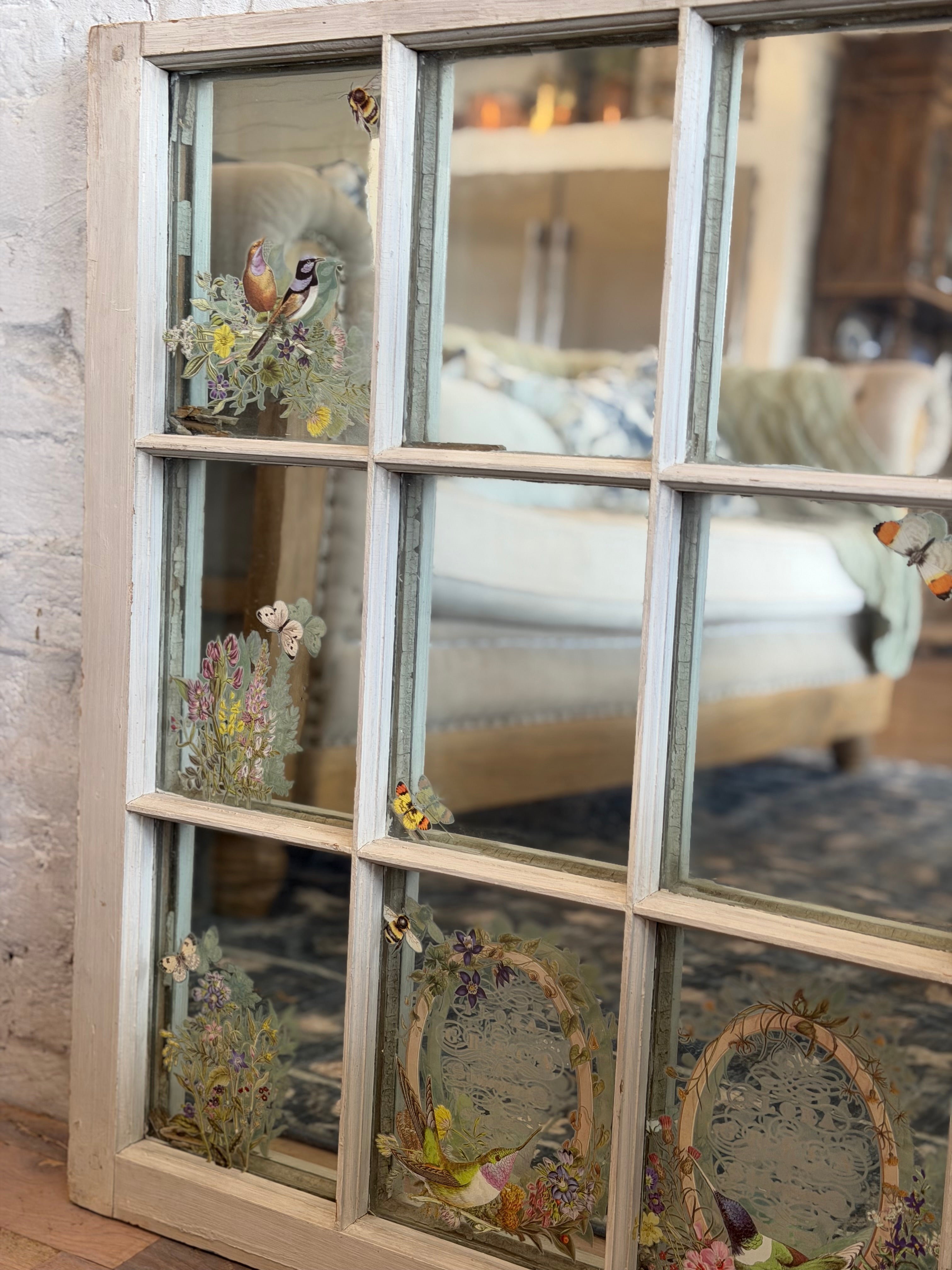 Window with old glass and mirror behind