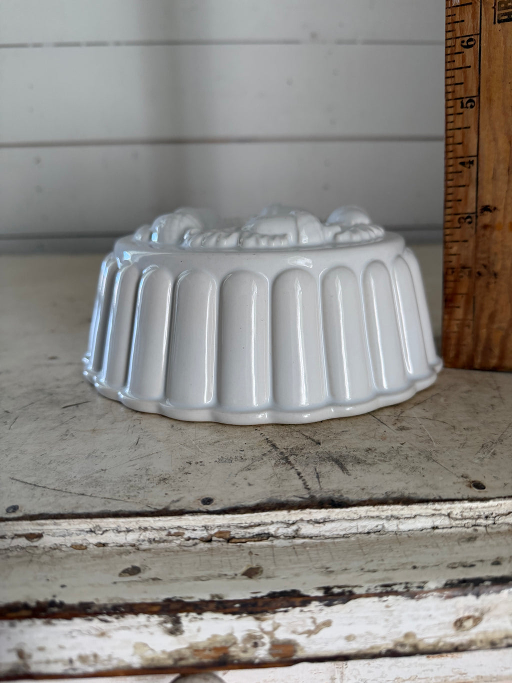 White Ceramic ring mold decorated with a raised acorn and oak leaf pattern
