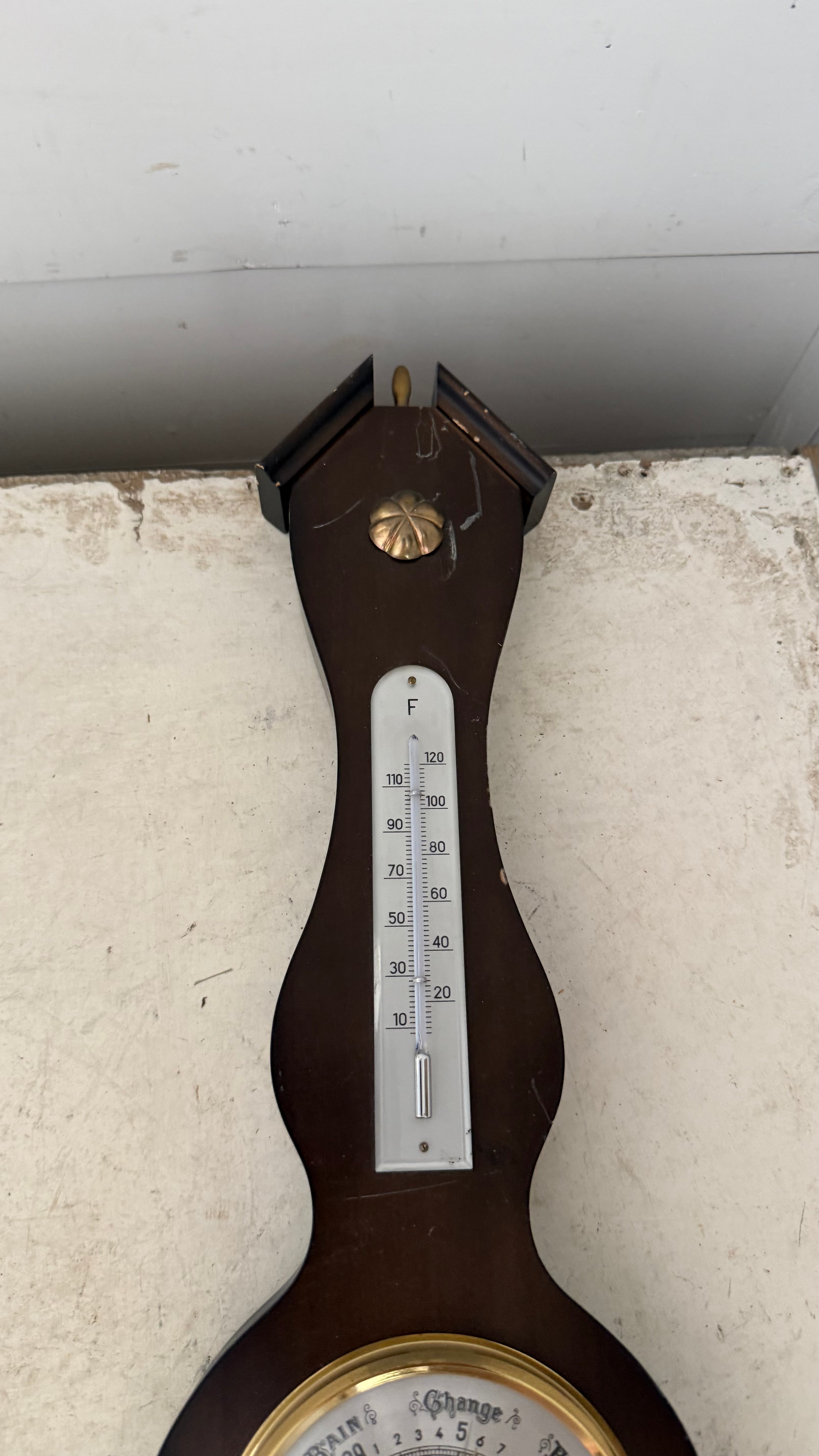 vintage German-made banjo-style weather station features a dark mahogany wood base, a barometer, a thermometer, and a hygrometer as is