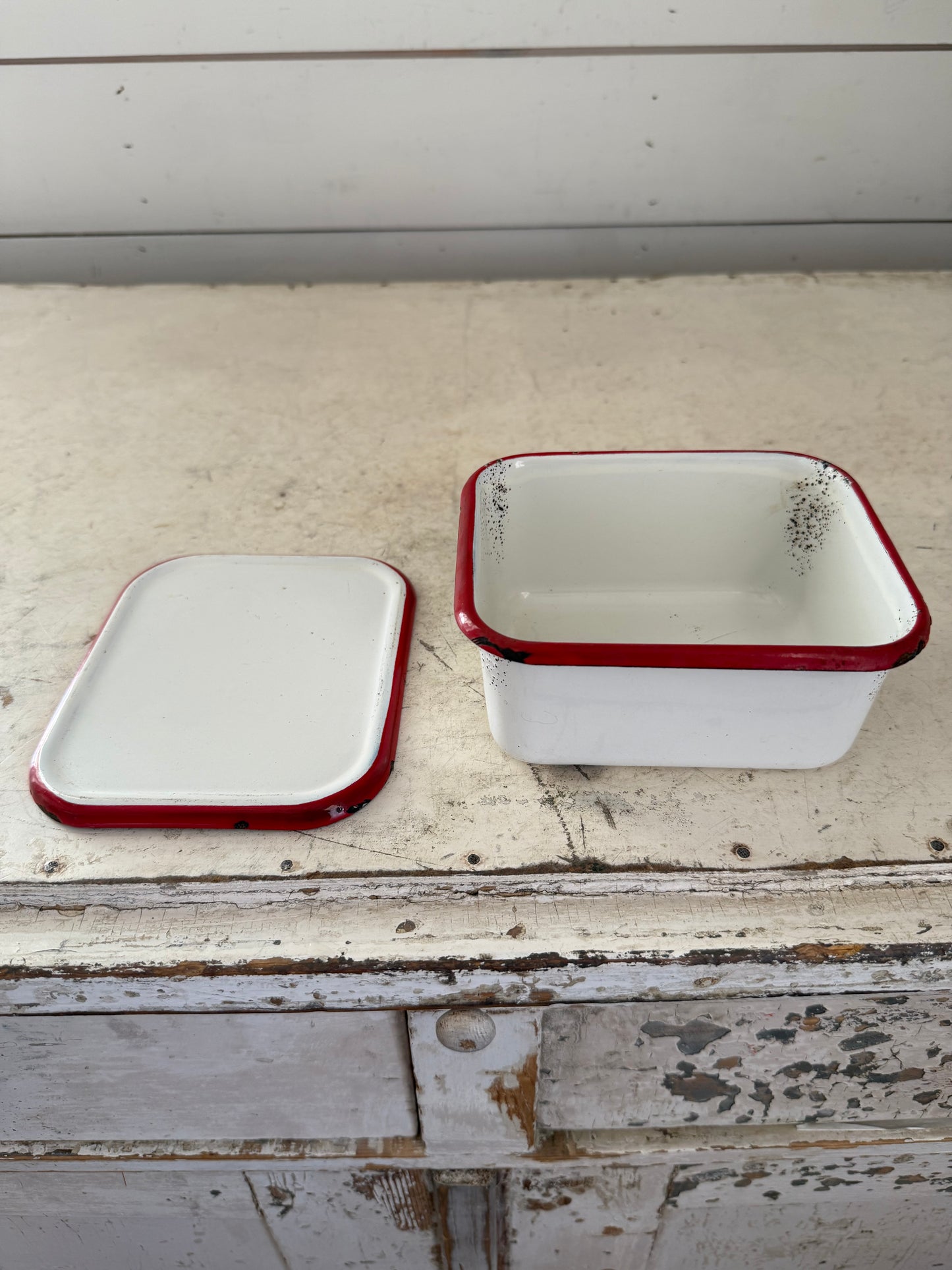 Red and white enamel Tin container