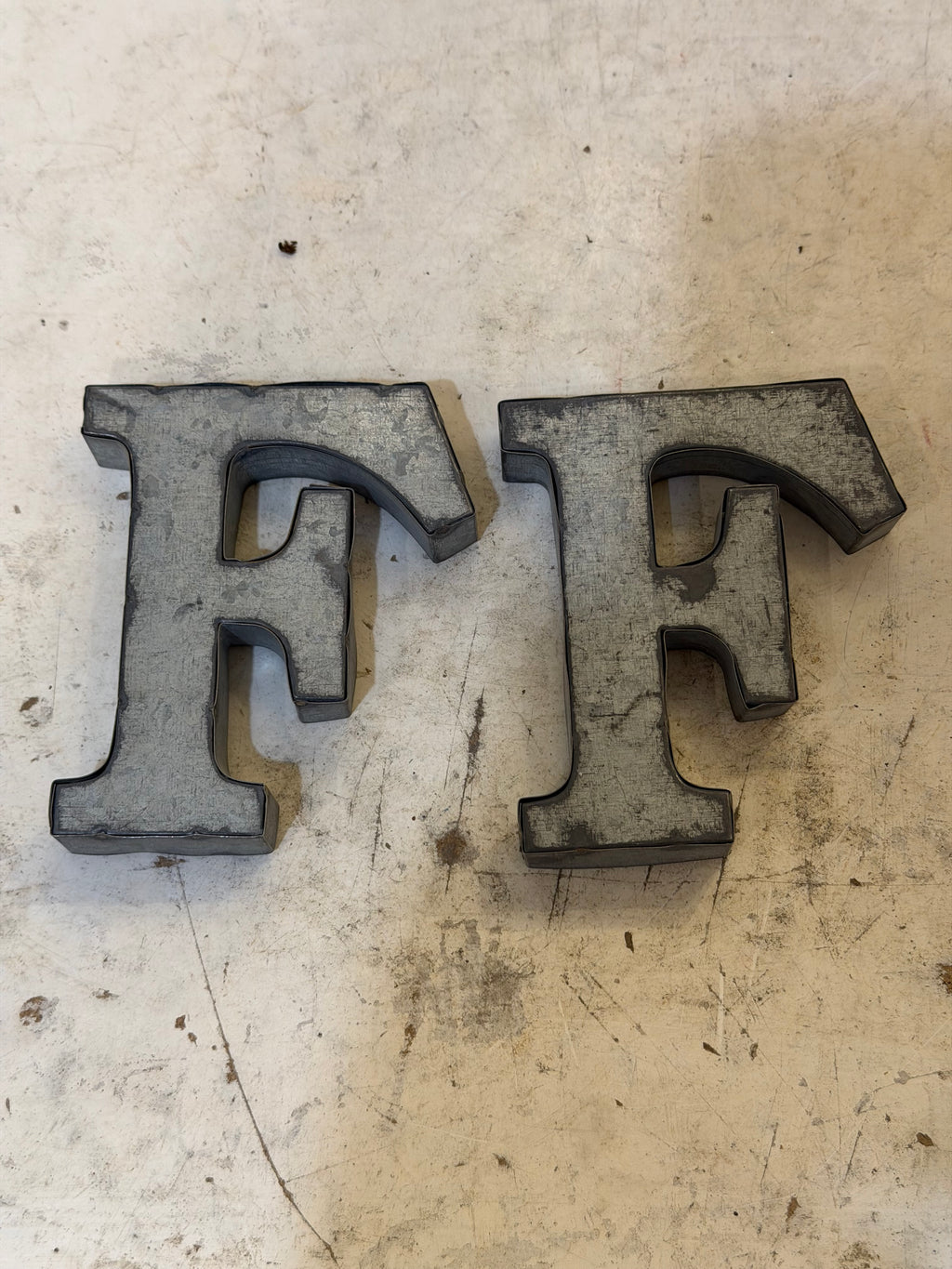 Rustic galvanized, tin letters sold individually Rusted galvanized, tin letters sold individually 3-3/4” - hanging hardware on back