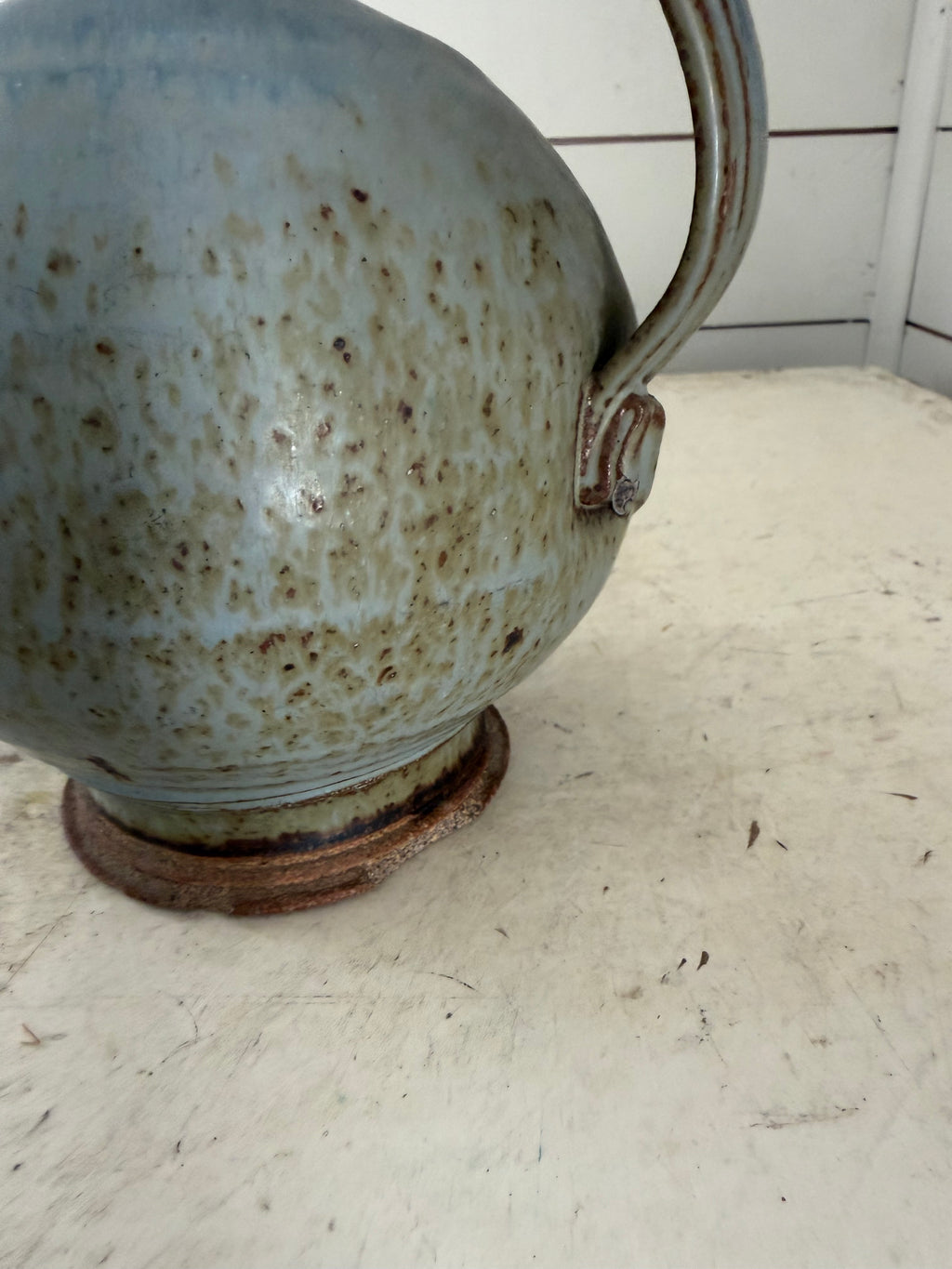 Vintage pottery studio jug has chips at base as shown