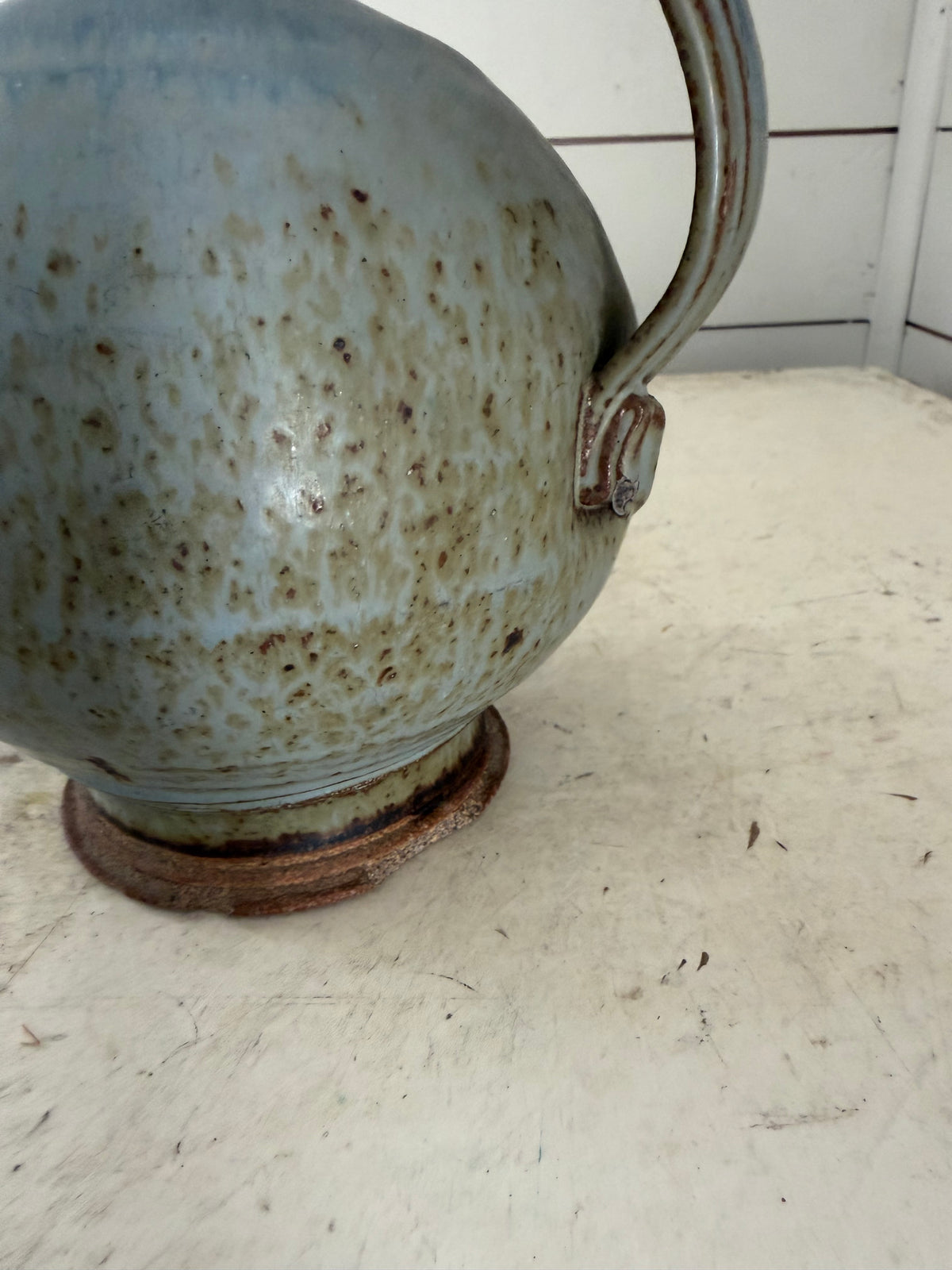Vintage pottery studio jug has chips at base as shown