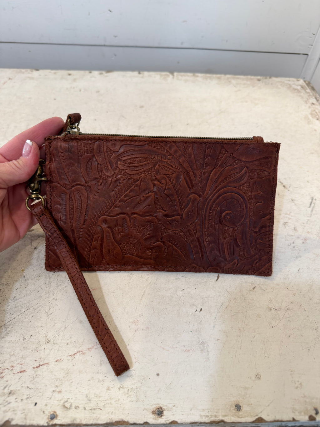 American Leather Co Leather floral embossed essential power wristlet