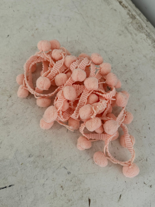 Peach pom poms