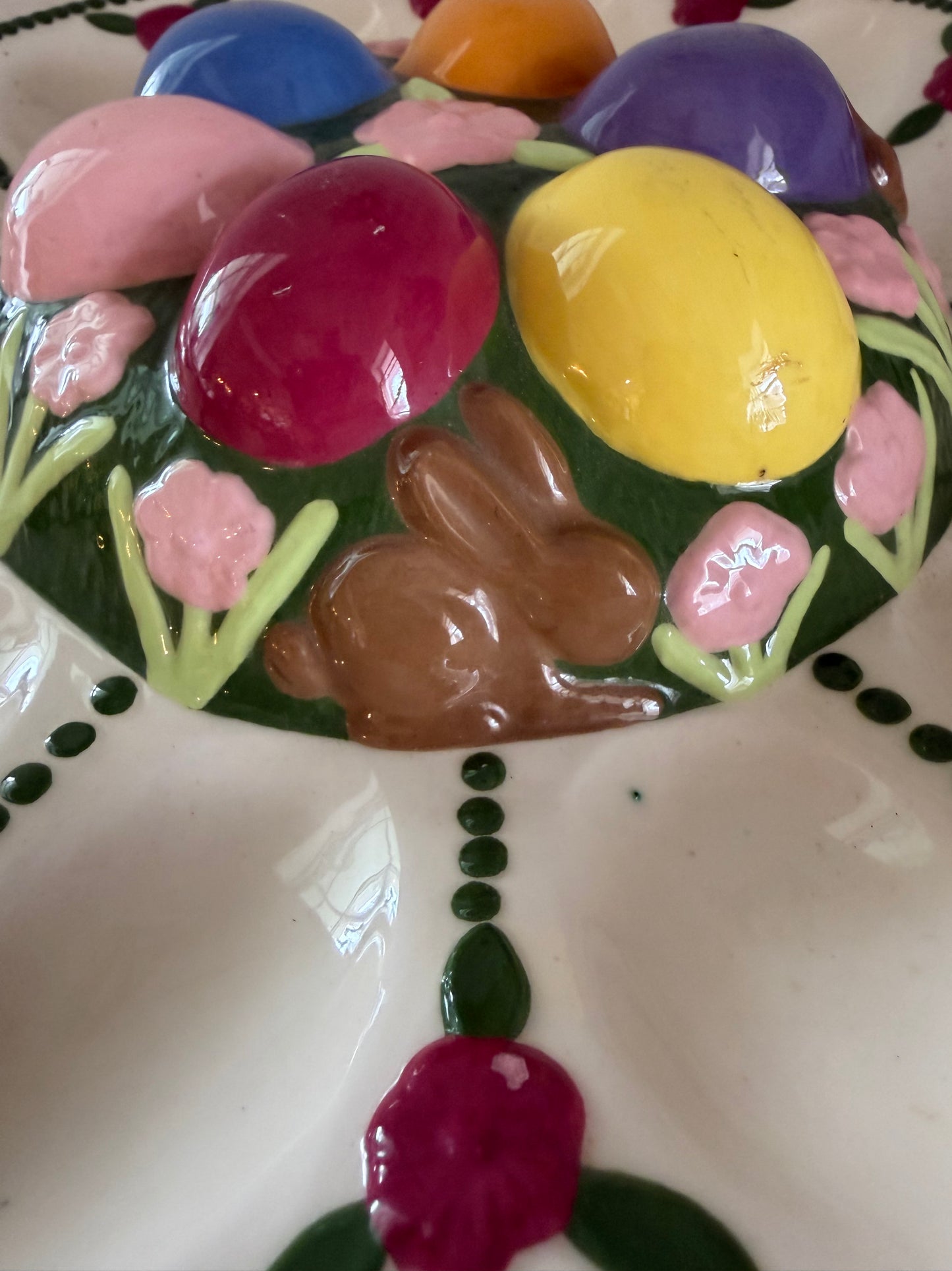 Vintage Easter deviled egg platter with chocolate bunnies, and flowers on it