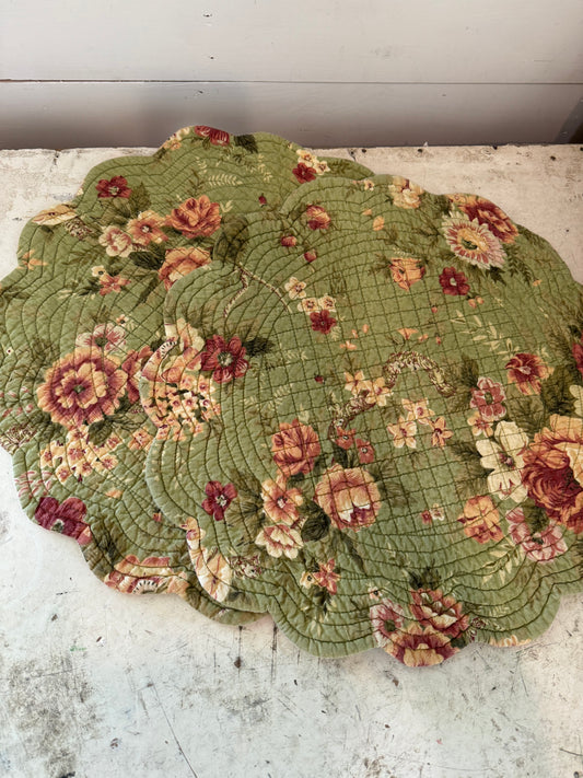 Set of round quilted placemats