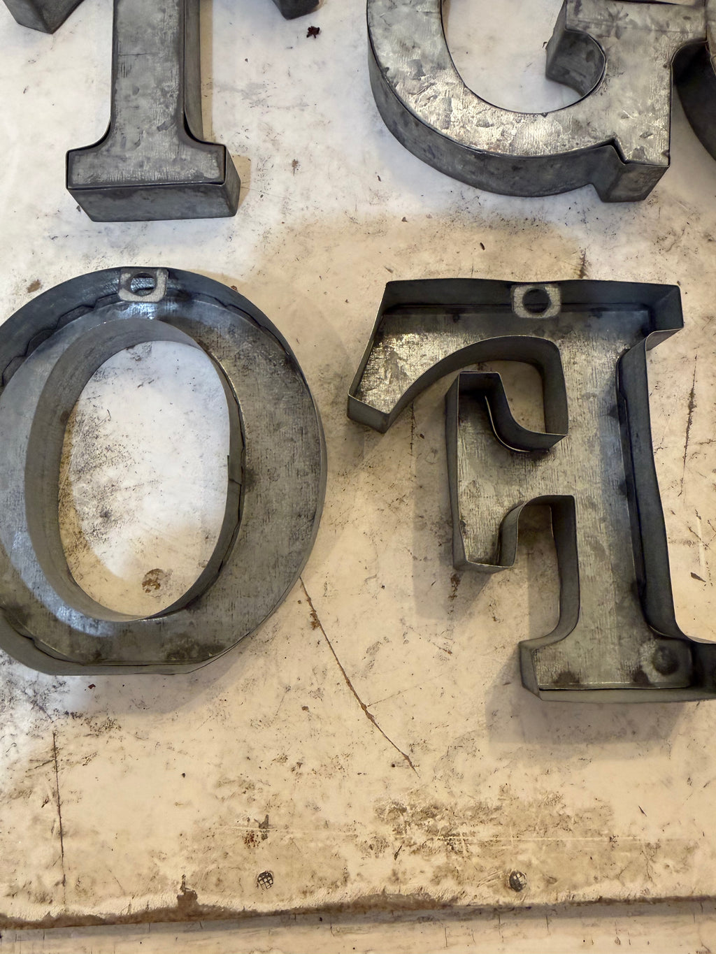 Rustic galvanized, tin letters sold individually Rusted galvanized, tin letters sold individually 3-3/4” - hanging hardware on back