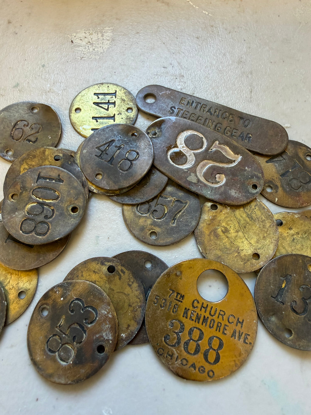Set of 24 vintage brass locker tags