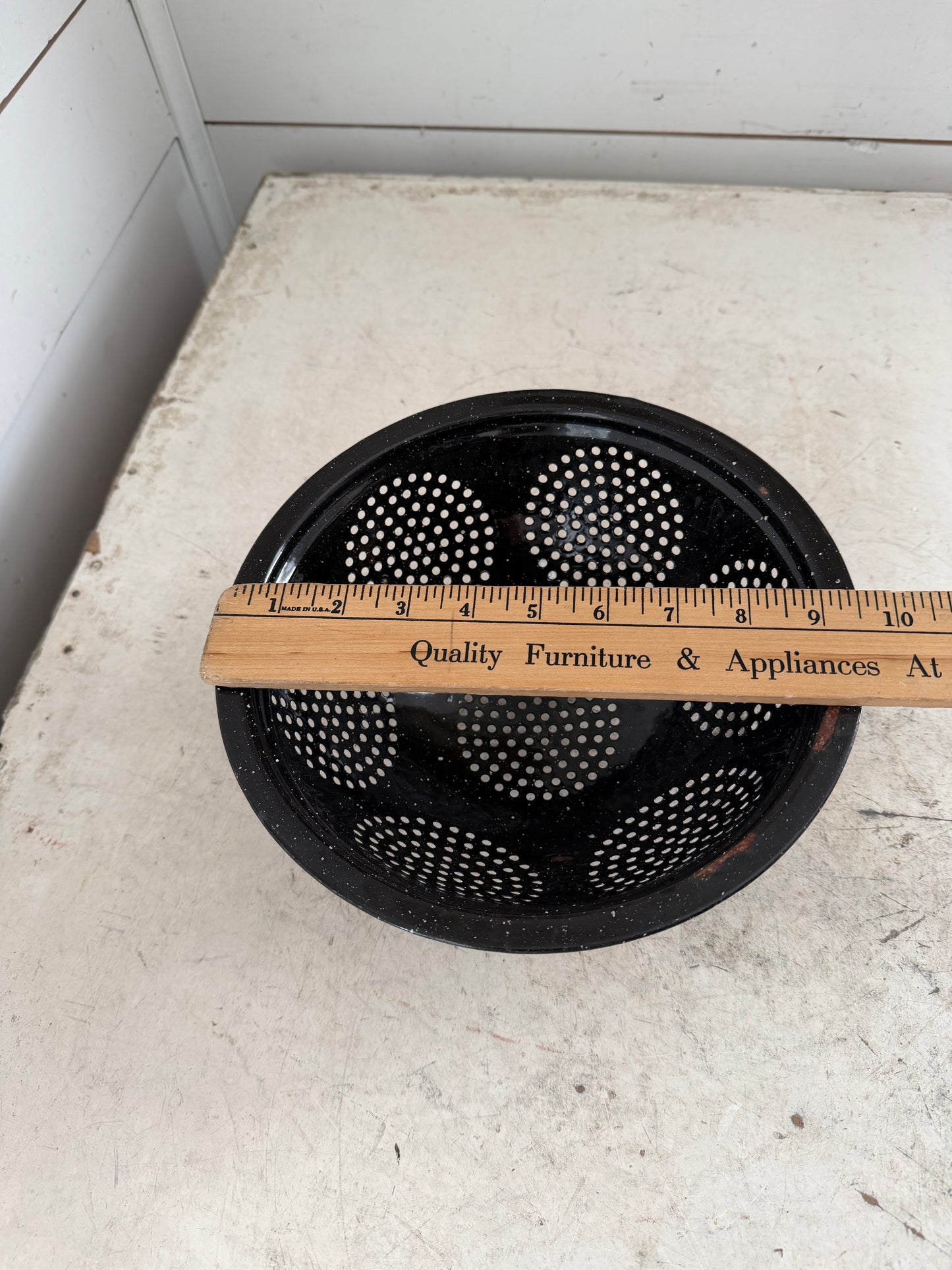 Vintage black speckled enamel colander - has some chips