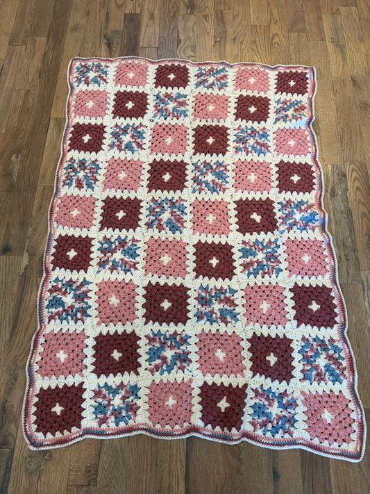 Pink, white, burgundy, and blue granny square Afghan