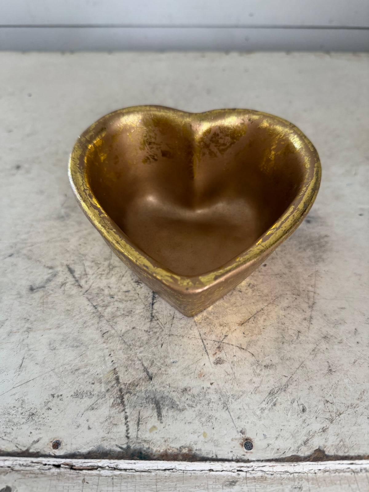 Gold colored heart shaped trinket bowl