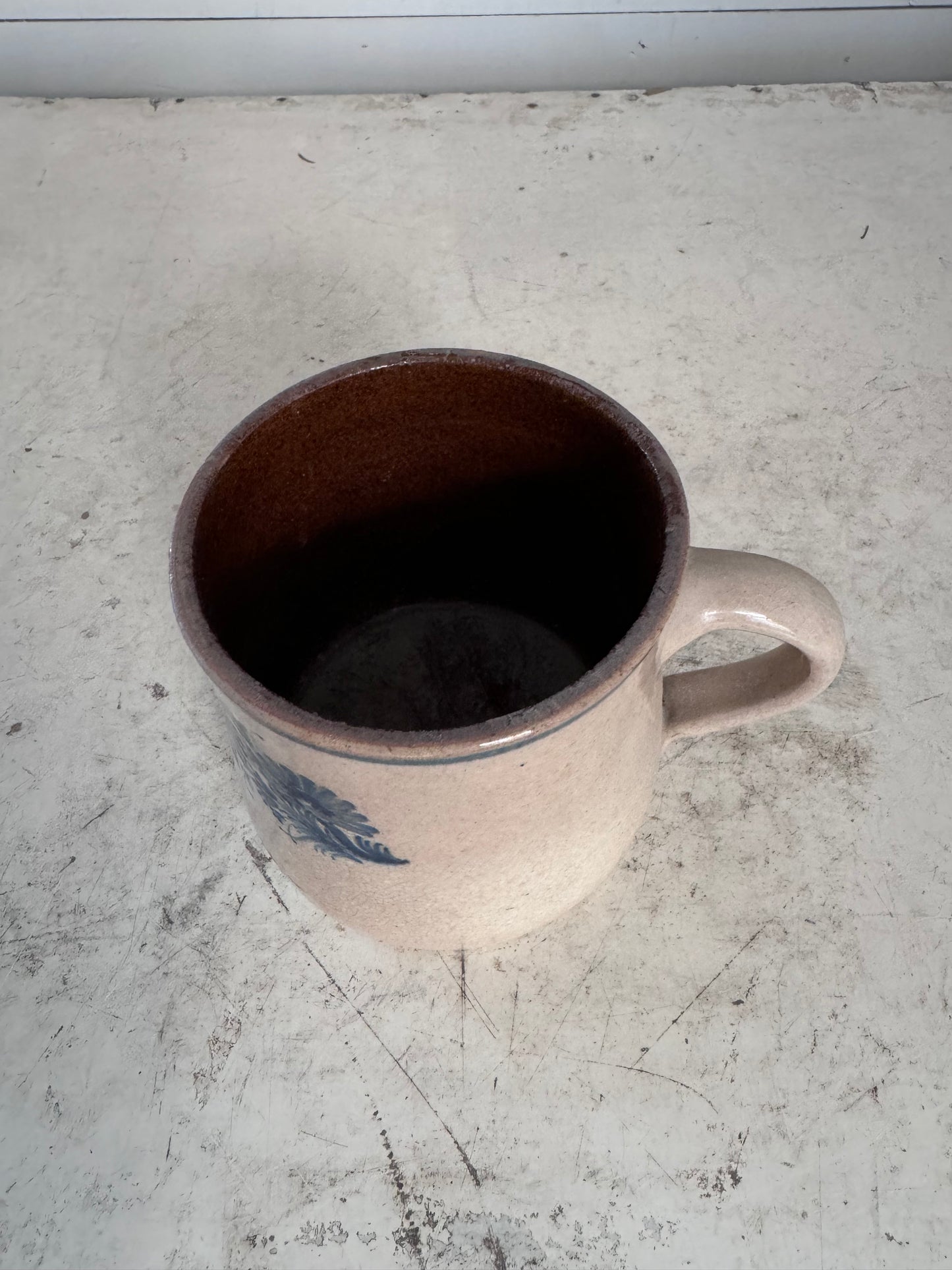 Antique blue floral print earthenware mug