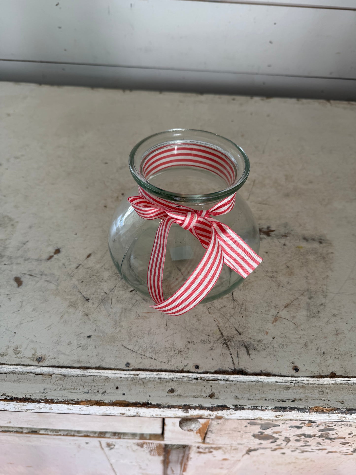 Vintage Green Glass Style Vase with red and white ribbon