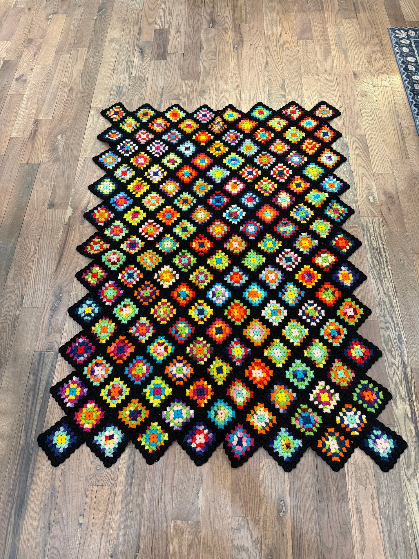 Granny Square in black with Colorful Afghan