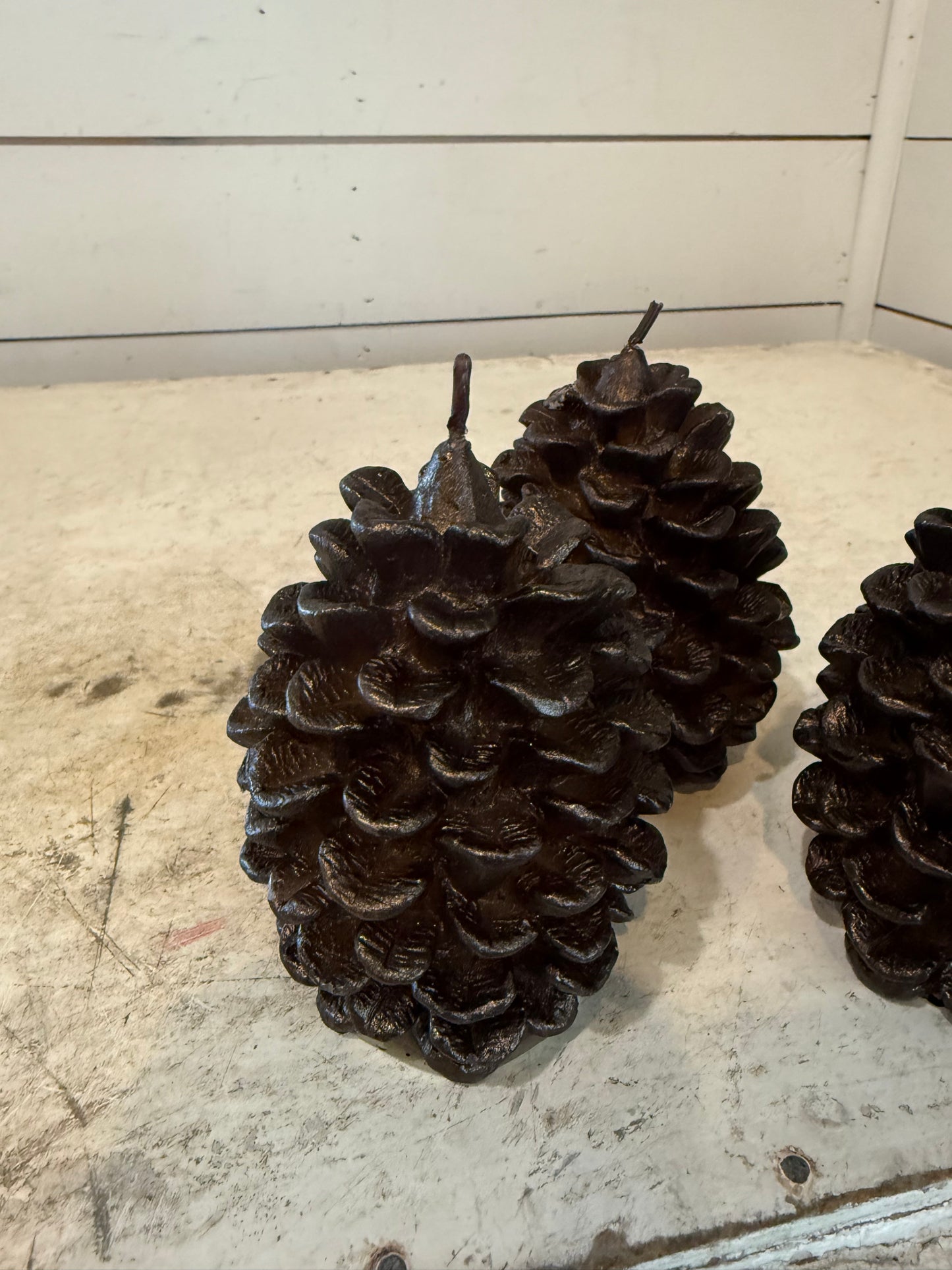 Pottery Barn brown metallic pinecone candle - some of the pinecone petals may be loose in bag - sold individually