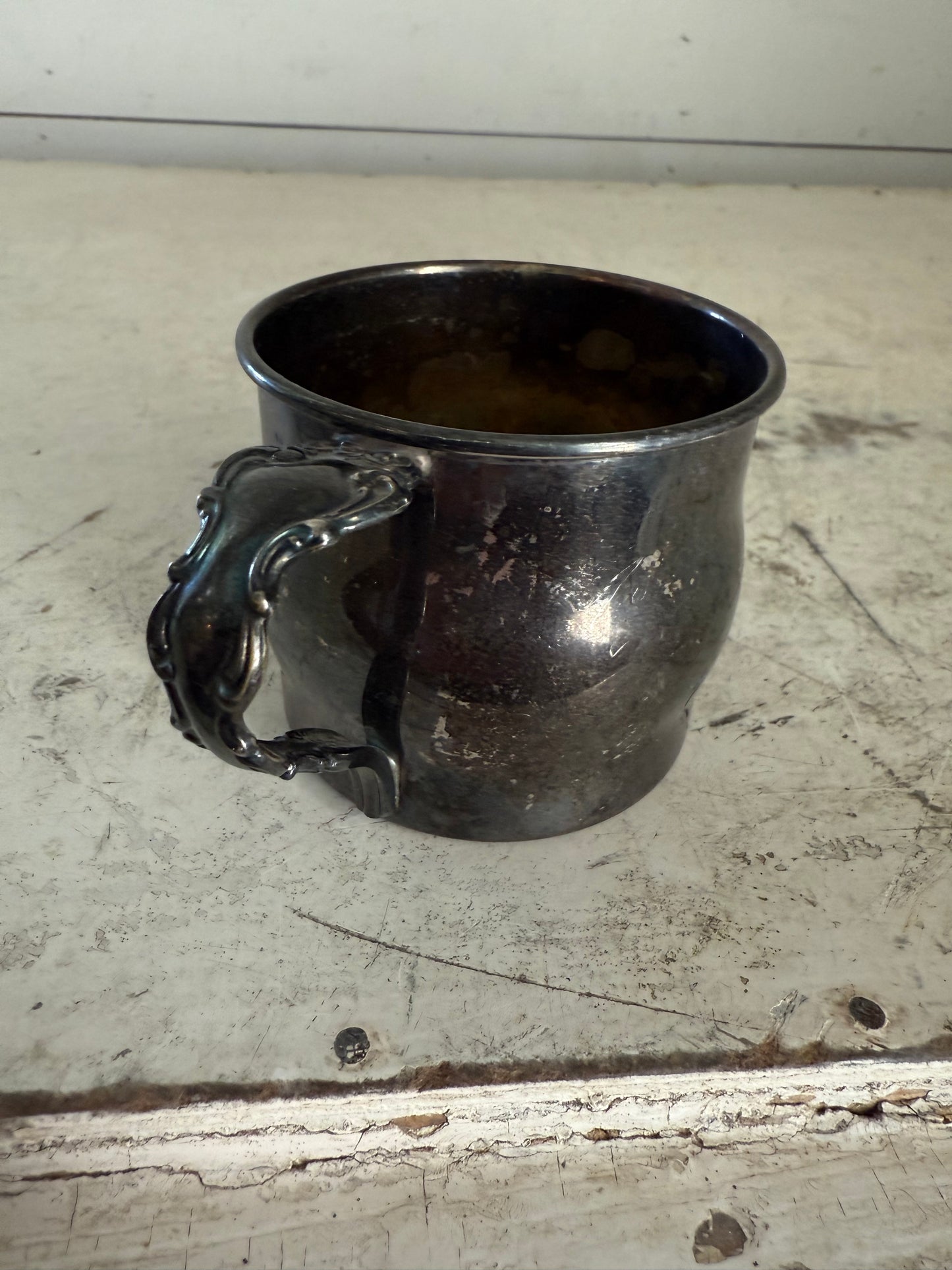 Silver plated baby cup made by community