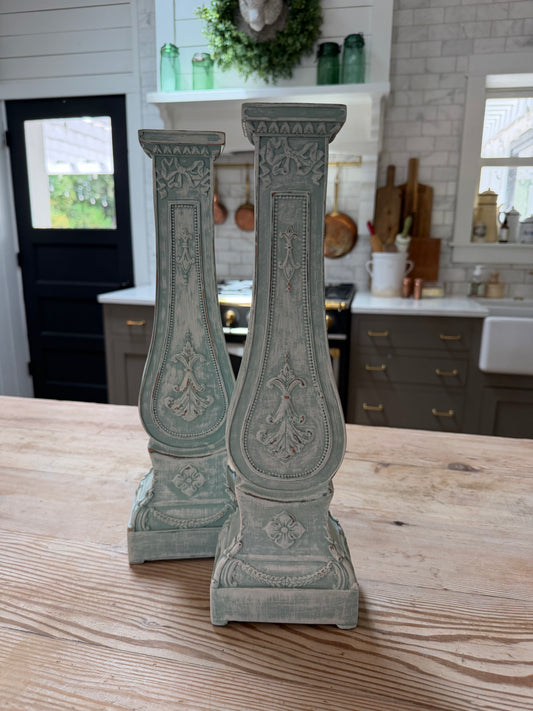 Set of decorative pillar candlesticks