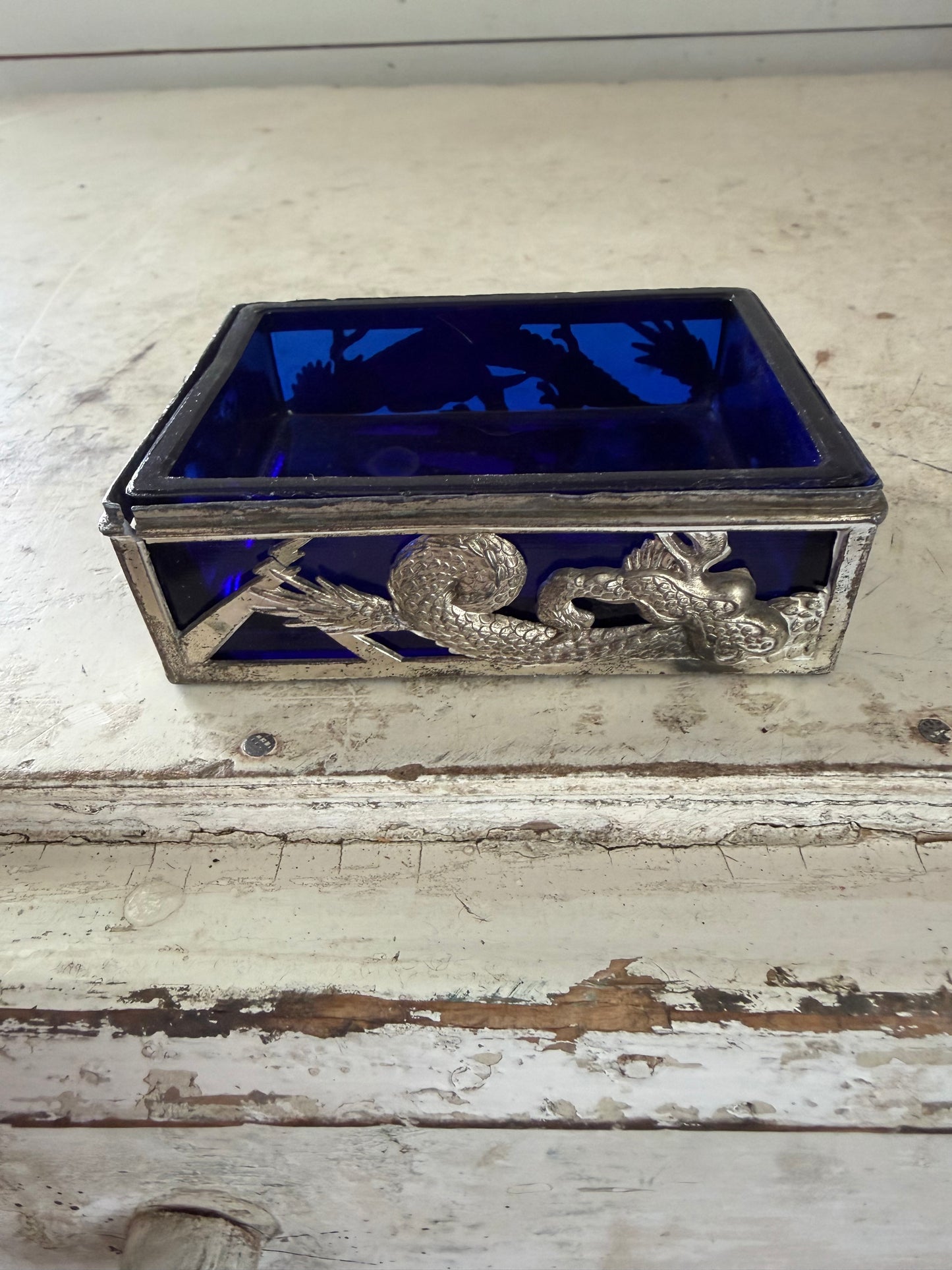 Vintage dragon themed trinket holder with cobalt blue glass insert